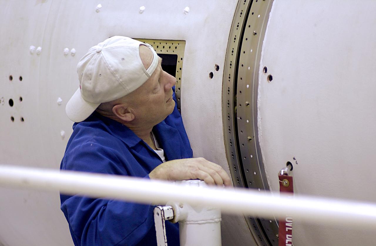 At Vandenberg Air Force Base in California, a technician checks the final step in mating of the first and second stages of the Orbital Sciences Pegasus XL rocket. The rocket is the launch vehicle for NASA's Aeronomy of Ice in the Mesosphere, or AIM, spacecraft. AIM is the seventh Small Explorers mission under NASA's Explorer Program. The program provides frequent flight opportunities for world-class scientific investigations from space within heliophysics and astrophysics. The AIM spacecraft will fly three instruments designed to study polar mesospheric clouds located at the edge of space, 50 miles above the Earth's surface in the coldest part of the planet's atmosphere. The mission's primary goal is to explain why these clouds form and what has caused them to become brighter and more numerous and appear at lower latitudes in recent years. AIM's results will provide the basis for the study of long-term variability in the mesospheric climate and its relationship to global climate change. AIM is scheduled to be mated to the Pegasus XL during the second week of April, after which final inspections will be conducted. Launch is scheduled for April 25.