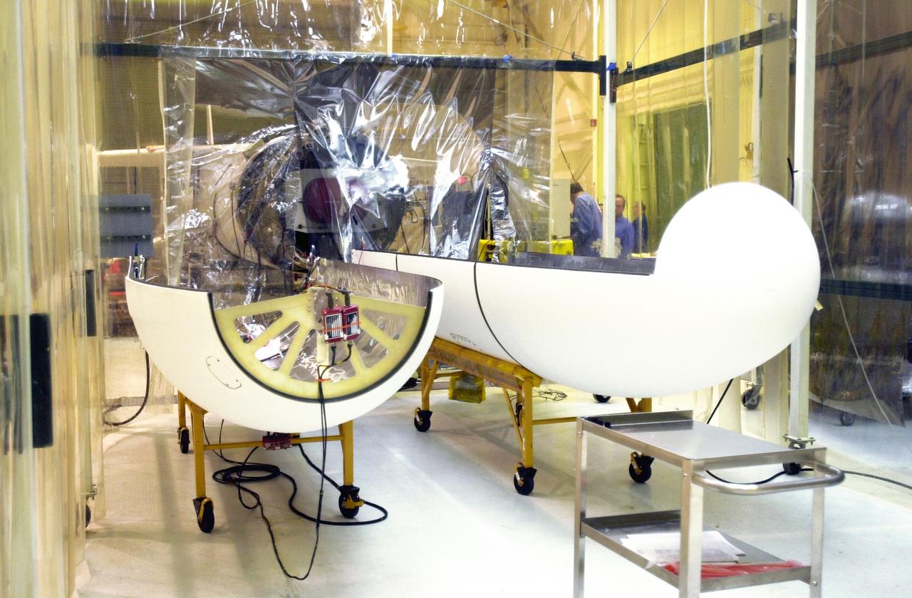 Seen at Vandenberg Air Force Base in California is the fairing (foreground) for the Orbital Sciences Pegasus XL rocket. In the background is the third stage, under the clean room tent. The rocket is the launch vehicle for NASA's Aeronomy of Ice in the Mesosphere, or AIM, spacecraft. AIM is the seventh Small Explorers mission under NASA's Explorer Program. The program provides frequent flight opportunities for world-class scientific investigations from space within heliophysics and astrophysics. The AIM spacecraft will fly three instruments designed to study polar mesospheric clouds located at the edge of space, 50 miles above the Earth's surface in the coldest part of the planet's atmosphere. The mission's primary goal is to explain why these clouds form and what has caused them to become brighter and more numerous and appear at lower latitudes in recent years. AIM's results will provide the basis for the study of long-term variability in the mesospheric climate and its relationship to global climate change. AIM is scheduled to be mated to the Pegasus XL during the second week of April, after which final inspections will be conducted. Launch is scheduled for April 25.