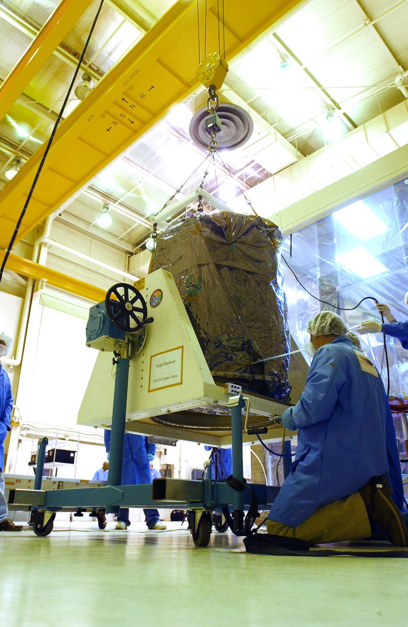 Inside a clean room at Vandenberg Air Force Base in California, NASA's Aeronomy of Ice in the Mesosphere, or AIM, spacecraft is weighed. AIM is the seventh Small Explorers mission under NASA's Explorer Program. The program provides frequent flight opportunities for world-class scientific investigations from space within heliophysics and astrophysics. The AIM spacecraft will fly three instruments designed to study polar mesospheric clouds located at the edge of space, 50 miles above the Earth's surface in the coldest part of the planet's atmosphere. The mission's primary goal is to explain why these clouds form and what has caused them to become brighter and more numerous and appear at lower latitudes in recent years. AIM's results will provide the basis for the study of long-term variability in the mesospheric climate and its relationship to global climate change. AIM is scheduled to be mated to the Pegasus XL during the second week of April, after which final inspections will be conducted. Launch is scheduled for April 25.