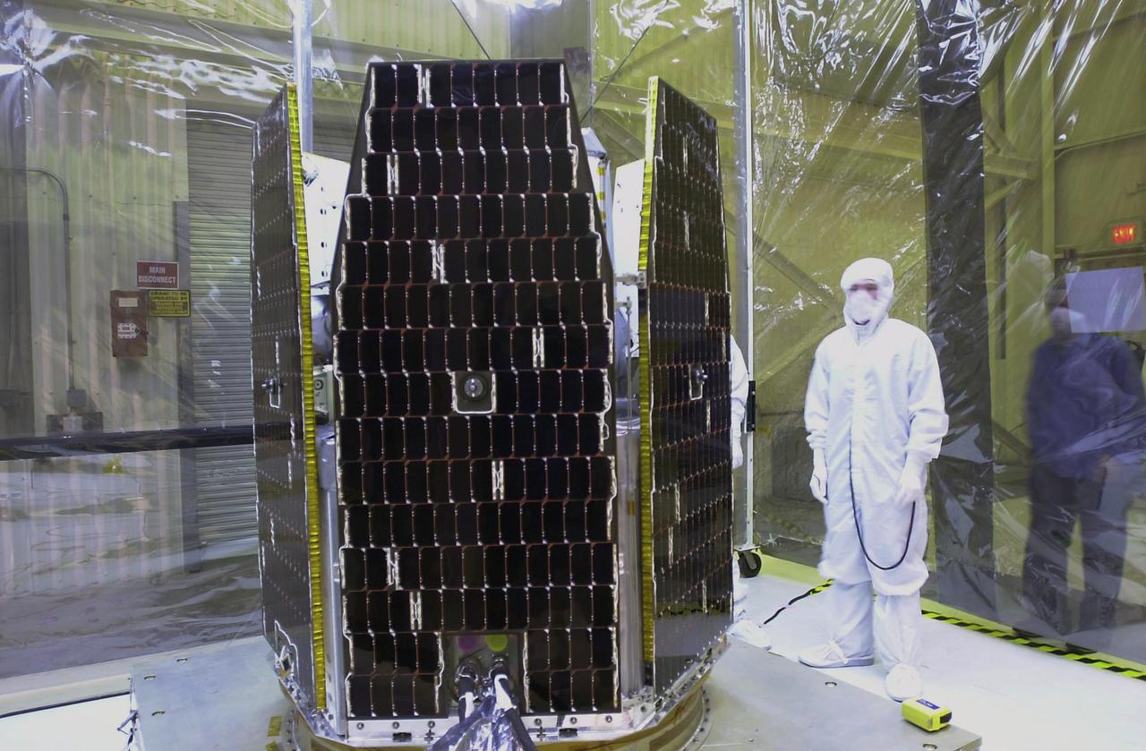 In a clean-room environment at North Vandenberg Air Force Base, a technician begins the illumination testing of the AIM spacecraft at left. The AIM spacecraft will fly three instruments designed to study those clouds located at the edge of space, 50 miles above the Earth's surface in the coldest part of the planet's atmosphere. The mission's primary goal is to explain why these clouds form and what has caused them to become brighter and more numerous and appear at lower latitudes in recent years. AIM's results will provide the basis for the study of long-term variability in the mesospheric climate and its relationship to global climate change. AIM is scheduled to be mated to the Pegasus XL during the second week of April, after which final inspections will be conducted. Launch is scheduled for April 25.