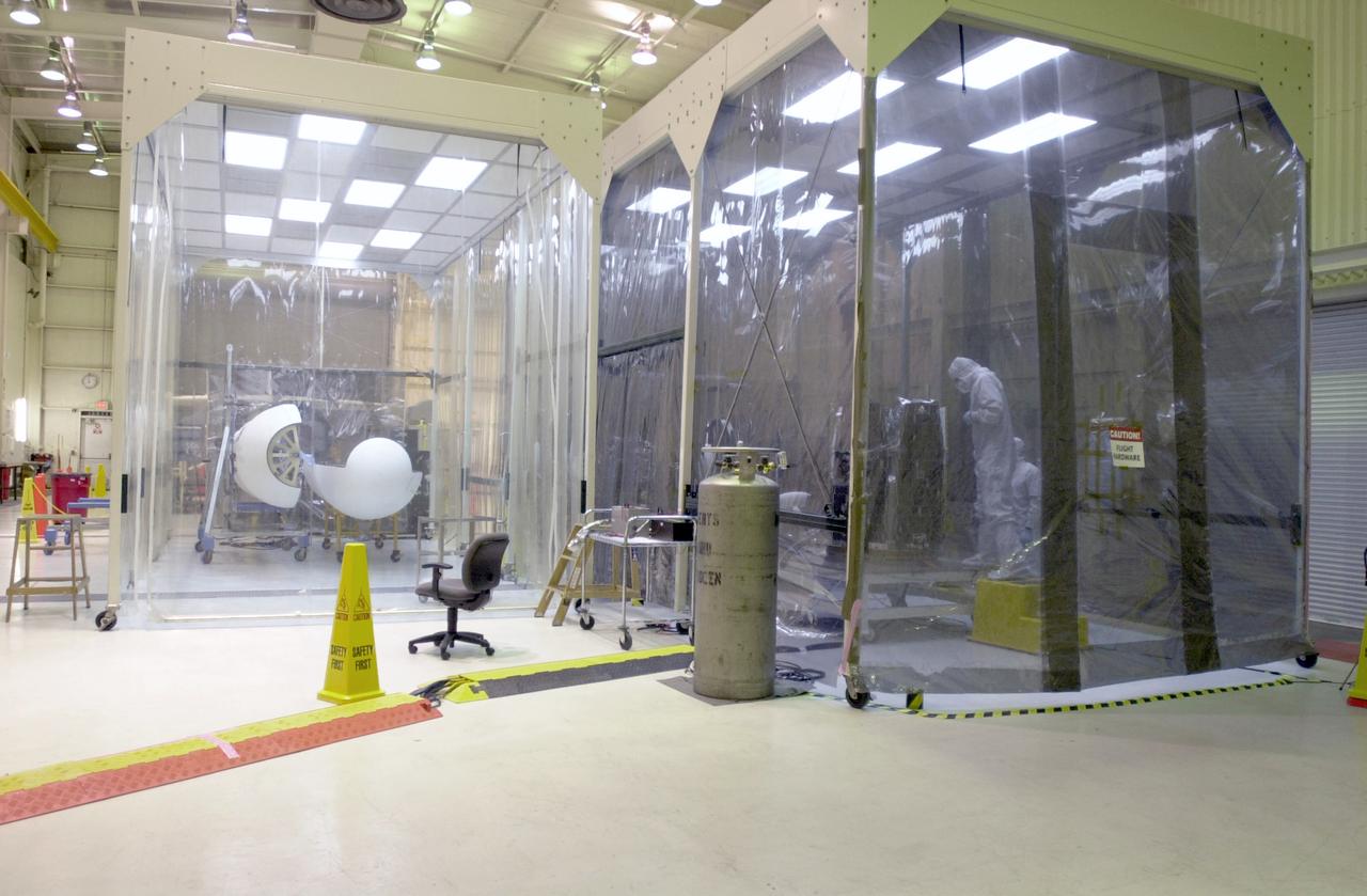 In a clean-room environment at North Vandenberg Air Force Base, technicians work on the AIM spacecraft. The AIM spacecraft will fly three instruments designed to study polar mesospheric clouds located at the edge of space, 50 miles above the Earth's surface in the coldest part of the planet's atmosphere. The mission's primary goal is to explain why these clouds form and what has caused them to become brighter and more numerous and appear at lower latitudes in recent years. AIM's results will provide the basis for the study of long-term variability in the mesospheric climate and its relationship to global climate change. AIM is scheduled to be mated to the Pegasus XL during the second week of April, after which final inspections will be conducted. Launch is scheduled for April 25.