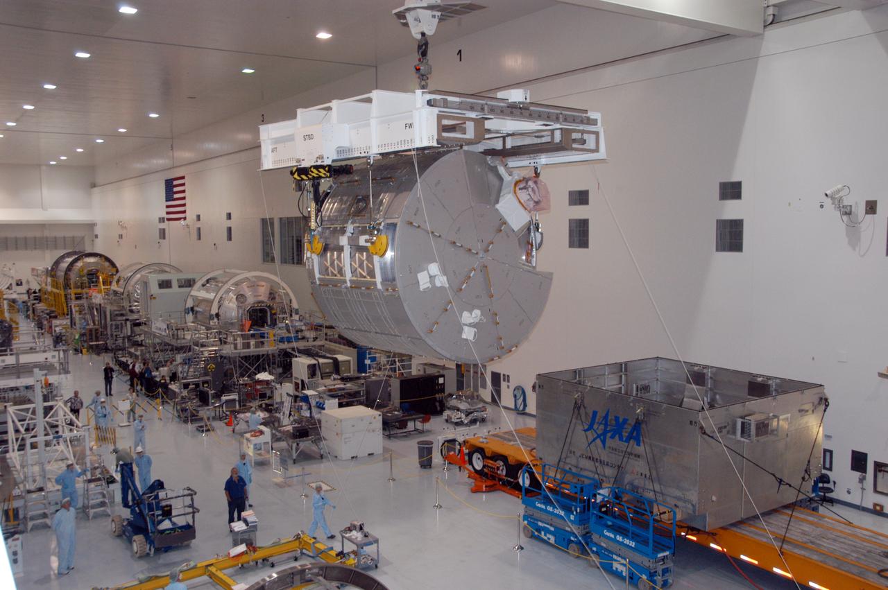 An overhead crane moves the JEM Experiment Logistics Module Pressurized Section above the floor of the Space Station Processing Facility to a scale for weight and center-of-gravity measurements. The module will then be moved to a work stand. The logistics module is one of the components of the Japanese Experiment Module or JEM, also known as Kibo, which means "hope" in Japanese. Kibo comprises six components: two research facilities -- the Pressurized Module and Exposed Facility; a Logistics Module attached to each of them; a Remote Manipulator System; and an Inter-Orbit Communication System unit. Kibo also has a scientific airlock through which experiments are transferred and exposed to the external environment of space. Kibo is Japan's first human space facility and its primary contribution to the station. Kibo will enhance the unique research capabilities of the orbiting complex by providing an additional environment in which astronauts can conduct science experiments. The various components of JEM will be assembled in space over the course of three Space Shuttle missions. The first of those three missions, STS-123, will carry the Experiment Logistics Module Pressurized Section aboard the Space Shuttle Endeavour, targeted for launch in 2007.