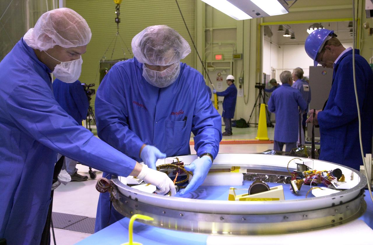 In Building 1555 on North Vandenberg Air Force Base in California, technicians work on the separation system to be mated to the AIM spacecraft. AIM, which stands for Aeronomy of Ice in the Mesosphere, is being prepared for integrated testing and a flight simulation. The AIM spacecraft will fly three instruments designed to study polar mesospheric clouds located at the edge of space, 50 miles above the Earth's surface in the coldest part of the planet's atmosphere. The mission's primary goal is to explain why these clouds form and what has caused them to become brighter and more numerous and appear at lower latitudes in recent years. AIM's results will provide the basis for the study of long-term variability in the mesospheric climate and its relationship to global climate change. AIM is scheduled to be mated to its launch vehicle, Orbital Sciences' Pegasus XL, during the second week of April, after which final inspections will be conducted. Launch is scheduled for April 25.