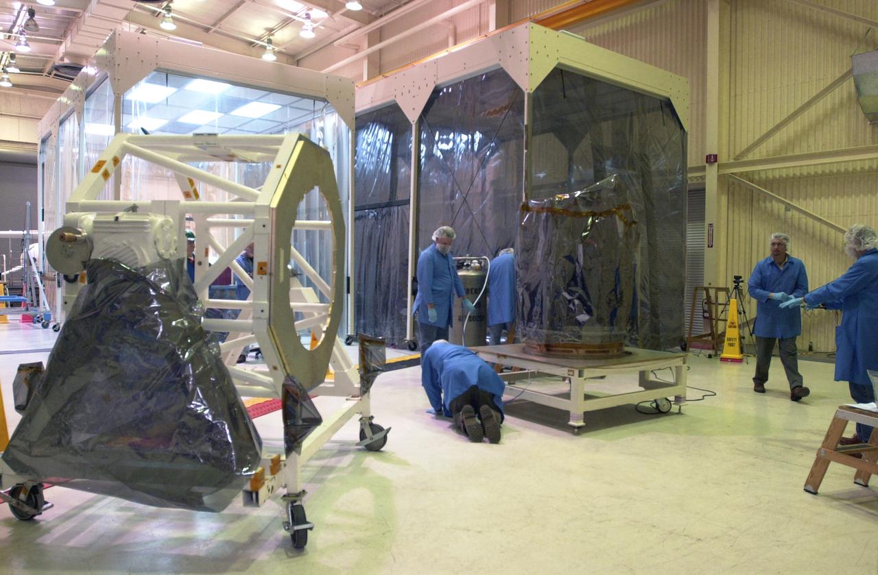In Building 1555 on North Vandenberg Air Force Base in California, technicians prepare the AIM spacecraft for integrated testing and a flight simulation. The AIM spacecraft will fly three instruments designed to study polar mesospheric clouds located at the edge of space, 50 miles above the Earth's surface in the coldest part of the planet's atmosphere. The mission's primary goal is to explain why these clouds form and what has caused them to become brighter and more numerous and appear at lower latitudes in recent years. AIM's results will provide the basis for the study of long-term variability in the mesospheric climate and its relationship to global climate change. AIM is scheduled to be mated to its launch vehicle, Orbital Sciences' Pegasus XL, during the second week of April, after which final inspections will be conducted. Launch is scheduled for April 25.