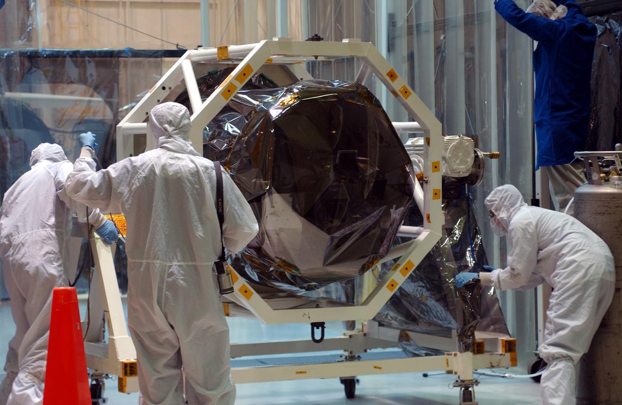 At North Vandenberg Air Force Base in California, the AIM spacecraft is prepared for its move to the clean room for testing. AIM, which stands for Aeronomy of Ice in the Mesosphere, is being prepared for integrated testing and a flight simulation. The AIM spacecraft will fly three instruments designed to study polar mesospheric clouds located at the edge of space, 50 miles above the Earth's surface in the coldest part of the planet's atmosphere. The mission's primary goal is to explain why these clouds form and what has caused them to become brighter and more numerous and appear at lower latitudes in recent years. AIM's results will provide the basis for the study of long-term variability in the mesospheric climate and its relationship to global climate change. AIM is scheduled to be mated to its launch vehicle, Orbital Sciences' Pegasus XL, during the second week of April, after which final inspections will be conducted. Launch is scheduled for April 25.