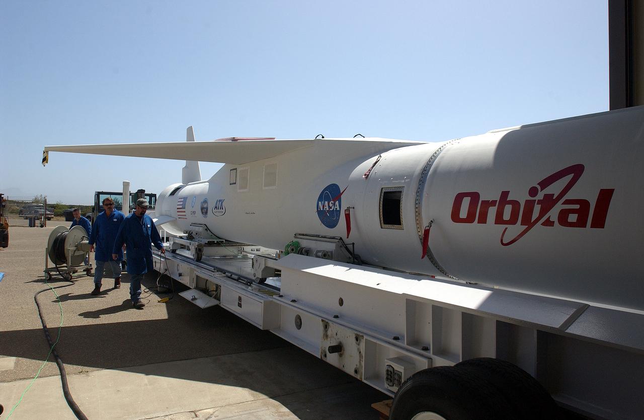 The mated Pegasus XL rocket - AIM spacecraft is secured onto a transporter at Vandenberg Air Force Base in California. The rocket will be transferred to a waiting Orbital Sciences Stargazer L-1011 aircraft for launch. AIM, which stands for Aeronomy of Ice in the Mesosphere, is being prepared for integrated testing and a flight simulation. The AIM spacecraft will fly three instruments designed to study polar mesospheric clouds located at the edge of space, 50 miles above the Earth's surface in the coldest part of the planet's atmosphere. The mission's primary goal is to explain why these clouds form and what has caused them to become brighter and more numerous and appear at lower latitudes in recent years. AIM's results will provide the basis for the study of long-term variability in the mesospheric climate and its relationship to global climate change. Launch is scheduled for April 25.