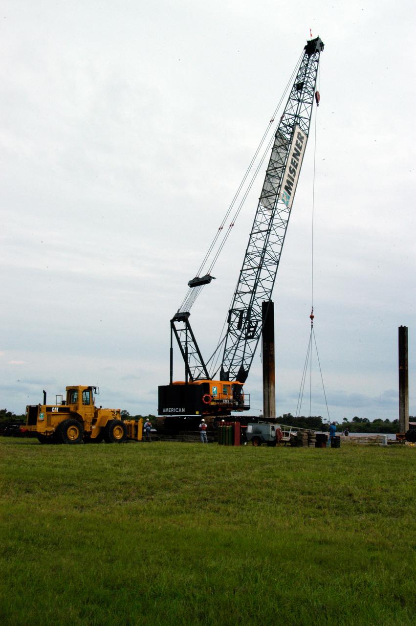 A large crawler crane arrives at the turn basin at the Launch Complex 39 Area on NASA's Kennedy Space Center. The crane with its 70-foot boom will be moved to Launch Pad 39B and used to construct a new lightning protection system for the Constellation Program and Ares/Orion launches. Pad B will be the site of the first Ares vehicle launch, including Ares I-X which is scheduled for April 2009.