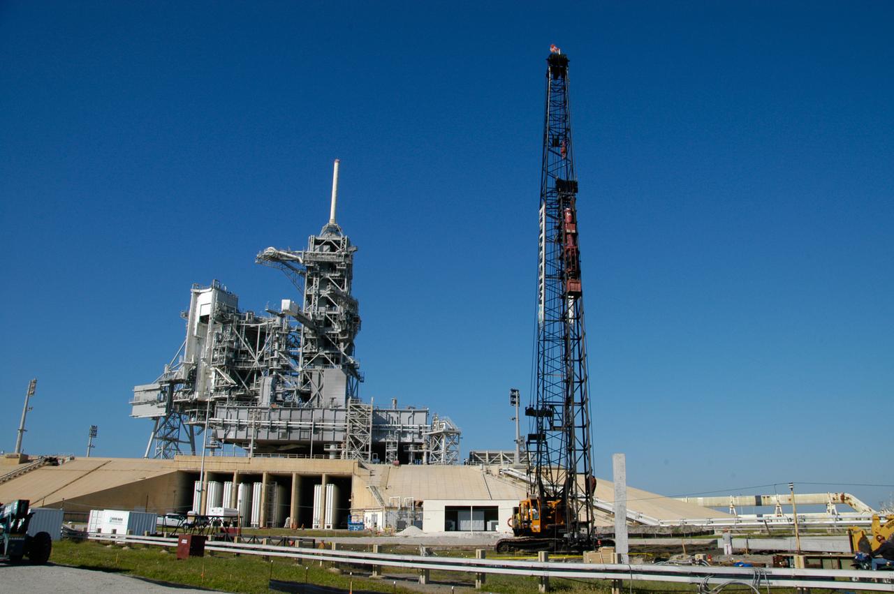 On Launch Pad 39B at NASA's Kennedy Space Center, pilings are being pounded into the ground to help construct lightning towers for the Constellation Program and Ares/Orion launches. Pad B will be the site of the first Ares vehicle launch, including Ares I-X which is scheduled for April 2009. 