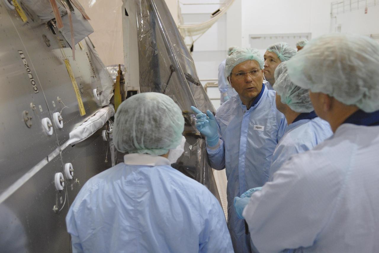KENNEDY SPACE CENTER, FLA. --  In the Space Station Processing Facility, STS-122 crew members inspect the Columbus European Laboratory, part of the payload on their mission.  Seen here is Commander Steve Frick. The crew is participating in a crew equipment interface test that provides opportunities for hands-on experience with payloads and equipment. The other crew members are Pilot Alan Poindexter and Mission Specialists Rex Walheim, Stan Love, Leland Melvin and Hans Schlegel, who represents the European Space Agency. The 24th mission to the International Space Station, STS-122 will also include the Multi-Purpose Experiment Support Structure - Non-Deployable (MPESS-ND). Launch of STS-122 on Space Shuttle Discovery is scheduled no earlier than October. Photo credit: NASA/Kim Shiflett
