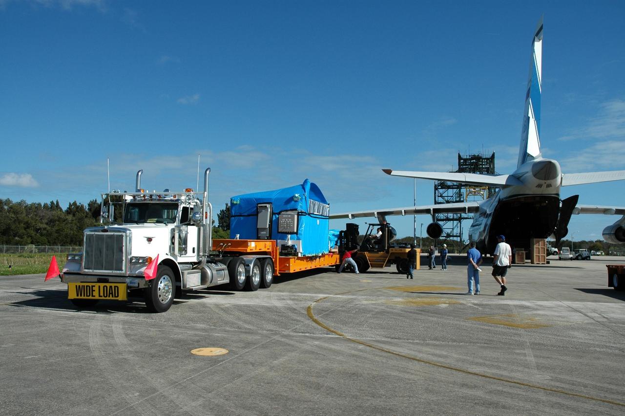 KENNEDY SPACE CENTER, FLA. --   Offloading of the cargo complete, the truck is ready to move the remote manipulator system for the Japanese Experiment Module to the Space Station Processing Facility.  The JEM, named "Kibo" (Hope), is Japan's primary contribution to the International Space Station. It will enhance the unique research capabilities of the orbiting complex by providing an additional environment for astronauts to conduct science experiments. The Japanese Aerospace Exploration Agency developed the laboratory. Both the JEM and RMS are targeted for mission STS-124, to launch in early 2008.  Photo credit: NASA/Dimitrios Gerondidakis