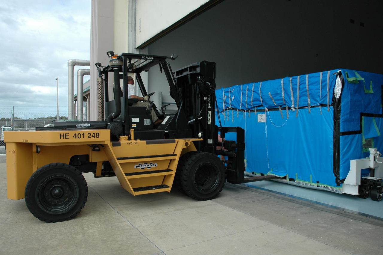KENNEDY SPACE CENTER, FLA. --  The remote manipulator system for the Japanese Experiment Module is being moved into the Space Station Processing Facility. The JEM, named "Kibo" (Hope), is Japan's primary contribution to the International Space Station. It will enhance the unique research capabilities of the orbiting complex by providing an additional environment for astronauts to conduct science experiments. The Japanese Aerospace Exploration Agency developed the laboratory. Both the JEM and RMS are targeted for mission STS-124, to launch in early 2008.  Photo credit: NASA/Dimitrios Gerondidakis