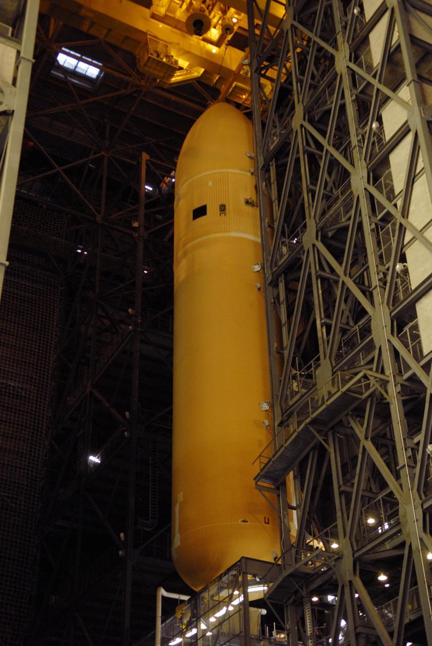 KENNEDY SPACE CENTER, FLA. --  External tank No. 124 is moved from its checkout cell in the Vehicle Assembly Building to high bay 1 where it will be mated with the solid rocket boosters for mission STS-117.  The boosters are already in place on the mobile launcher platform in the VAB.  The mission is targeted to launch on March 16 aboard Space Shuttle Atlantis.  Photo credit: NASA/Kim Shiflett