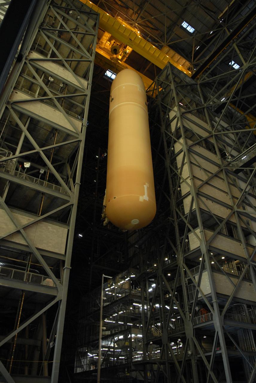 KENNEDY SPACE CENTER, FLA. --  External tank No. 124 is lowered into high bay 1 of the Vehicle Assembly Building where it will be mated with the solid rocket boosters for mission STS-117.  The boosters are already in place on the mobile launcher platform in the VAB.  The mission is targeted to launch on March 16 aboard Space Shuttle Atlantis.  Photo credit: NASA/Kim Shiflett