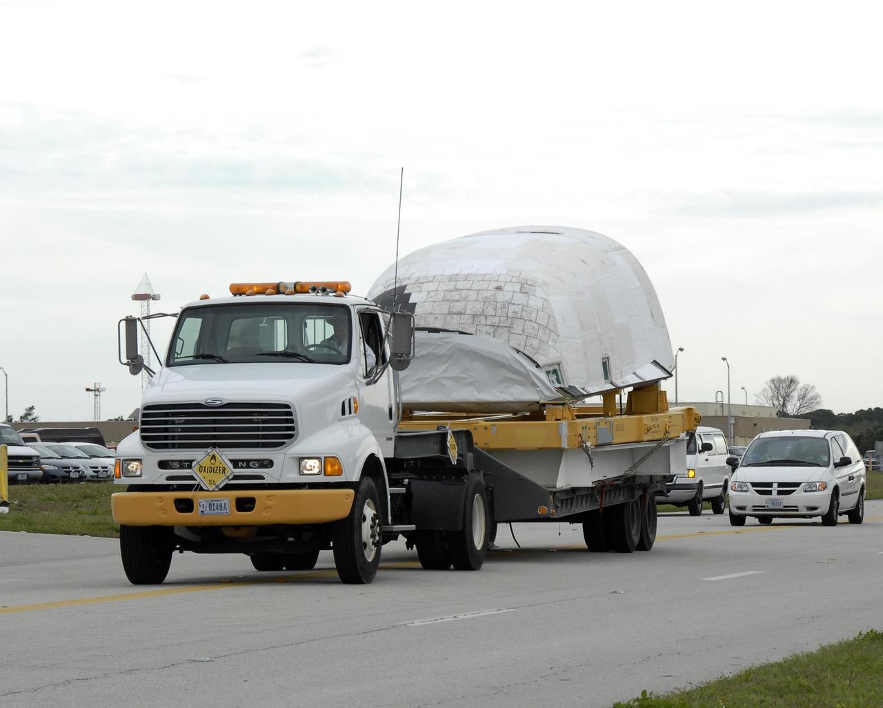 KENNEDY SPACE CENTER, FLA. -- The right-hand orbital maneuvering system pod is being delivered to Orbiter Processing Facility bay 2 for installation on the orbiter Endeavour. The orbital maneuvering system/reaction control system left- and right-hand pods are attached to the upper aft fuselage left and right sides. Each pod is fabricated primarily of graphite epoxy composite and aluminum. Each pod is 21.8 feet long and 11.37 feet wide at its aft end and 8.41 feet wide at its forward end, with a surface area of approximately 435 square feet. The orbiter is being prepared for its first launch in just over four years. The vehicle has undergone an extensive modification period, including the addition of all of the return-to-flight safety upgrades added to both Discovery and Atlantis. Endeavour is targeted for launch of mission STS-118 on June 28. Photo credit: NASA/Kim Shiflett