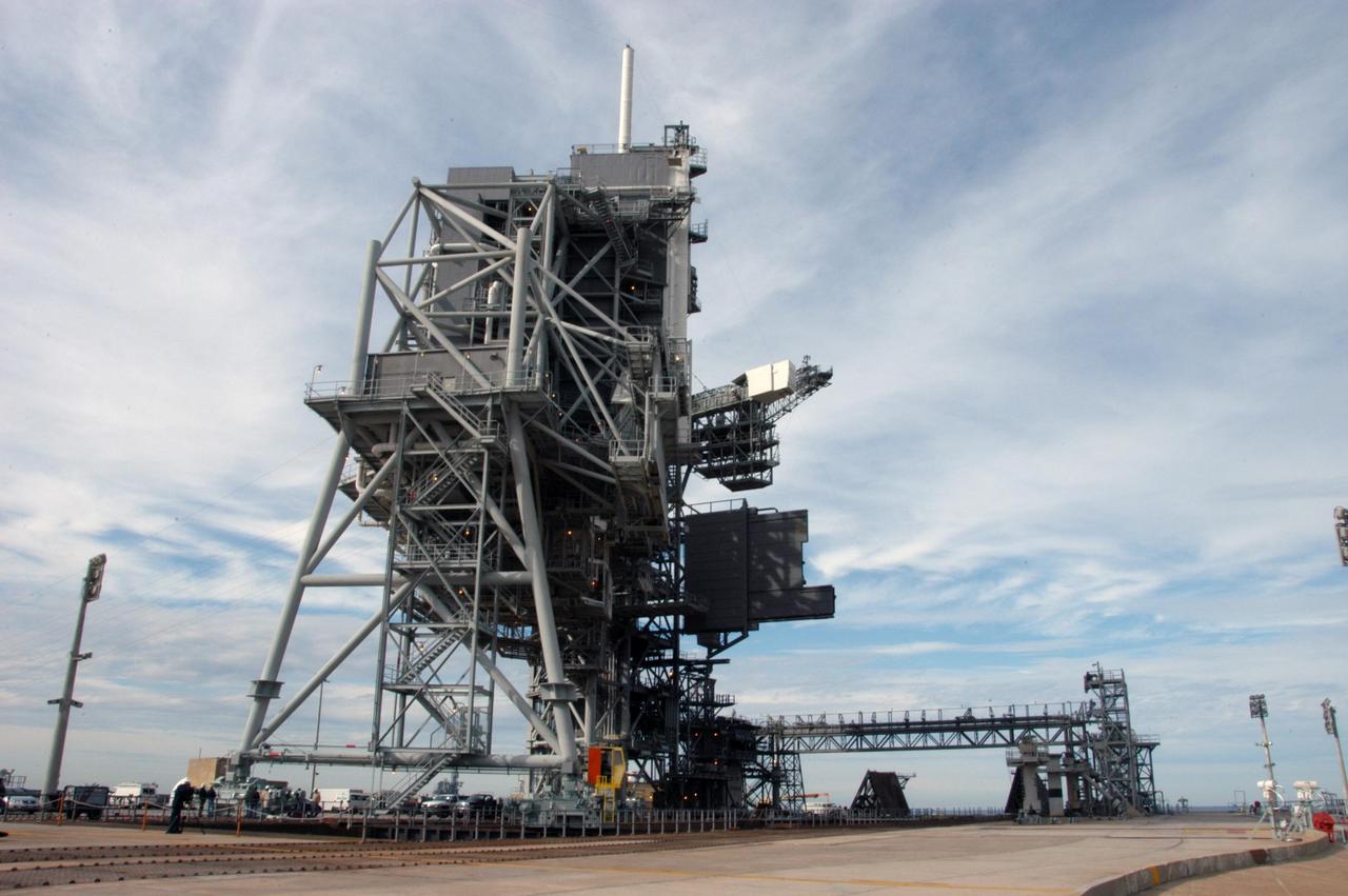 KENNEDY SPACE CENTER, FLA. --   The rotating service structure on Launch Pad 39A is being moved for the first time in more than a year due to maintenance and upgrades on the pad. Some of the work included sandblasting the structure to remove rust and repainting.  In addition, the RSS was jacked up and a new upper-bearing race assembly installed where the RSS pivots against the fixed service structure and a half-inch steel plate added.  Pad 39A is being made ready for its first launch in four years, the upcoming STS-117 on March 15.  Photo credit: NASA/George Shelton