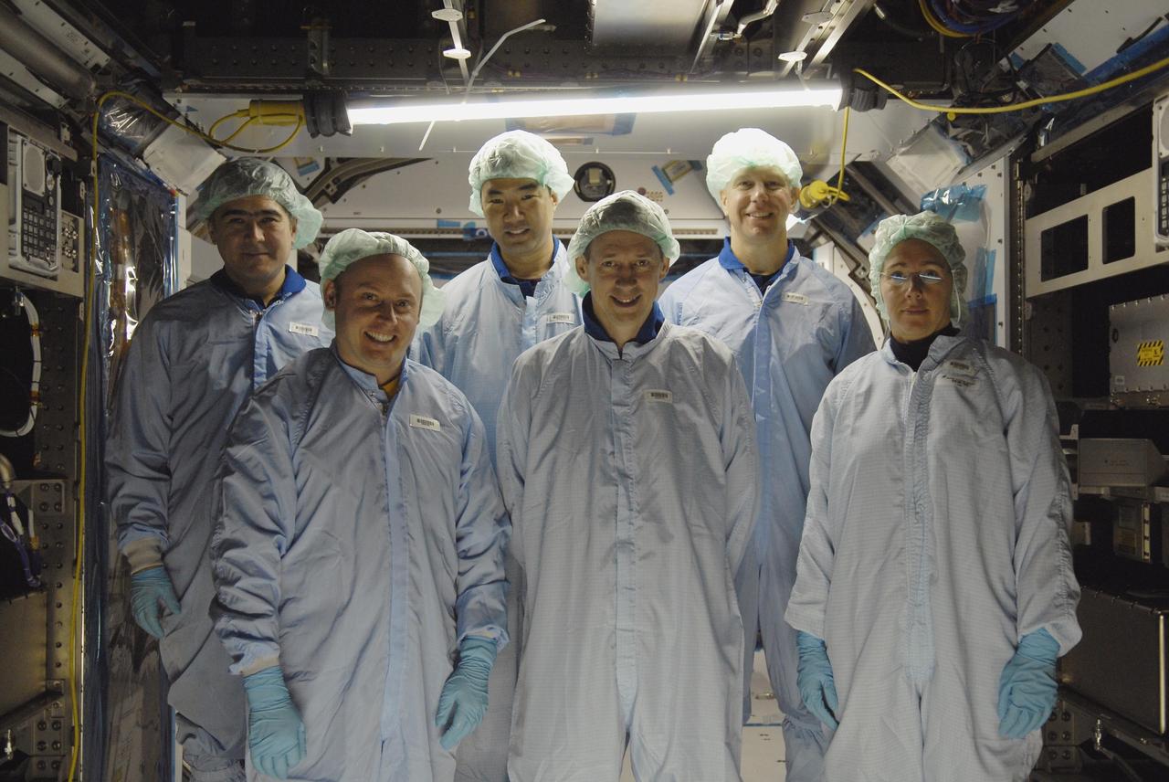 KENNEDY SPACE CENTER, FLA. -- Astronauts are in the Space Station Processing Facility to familiarize themselves with the various elements to be installed on the International Space Station on future spaceflights. Seen here in the Columbus module are (front) Michael Fincke, Frank DeWinne and Sandra Magnuson; (back) Salizhan Sharipov, Soichi Noguchi and Tim Kopra. With construction of the Space Station the primary focus of future shuttle missions, astronaut crews will be working with one or more of the elements and hardware already being processed in the SSPF. Photo credit: NASA/Kim Shiflett