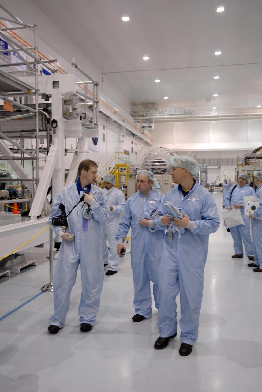 KENNEDY SPACE CENTER, FLA. --   Walking through the Space Station Processing Facility are astronauts Frank DeWinne, Michael Fincke and Tim Kopra.  They are familiarizing themselves with the various elements to be installed on the International Space Station on future spaceflights.  With construction of the Space Station the primary focus of future shuttle missions, astronaut crews will be working with one or more of the elements and hardware already being processed in the SSPF.  Photo credit: NASA/Kim Shiflett