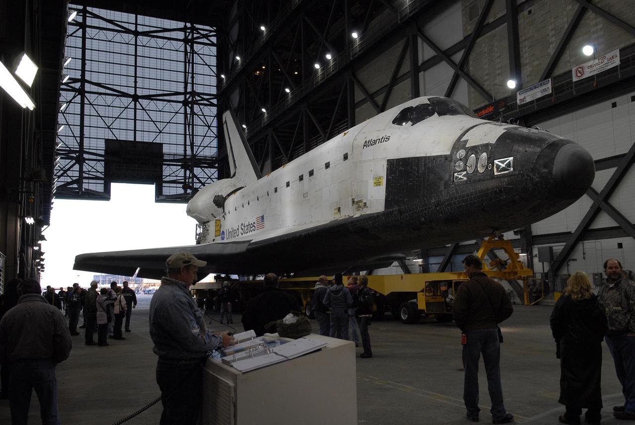 KENNEDY SPACE CENTER, FLA. --    The orbiter Atlantis, on top of its transporter, comes to a stop in the transfer aisle of the Vehicle Assembly Building after the short trip from the Orbiter Processing Facility.  First motion out of OPF was at 6:19 a.m. EST.  Once in the VAB, Atlantis will be lifted into high bay 1 and mated with the external tank and solid rocket boosters already in place on the mobile launcher platform. The rollover signals the start of the journey to the launch pad for liftoff on mission STS-117 targeted for March 15.  The mission is the 21st to the International Space Station and will deliver the S3/S4 starboard truss segments.  Photo credit: NASA/Kim Shiflett