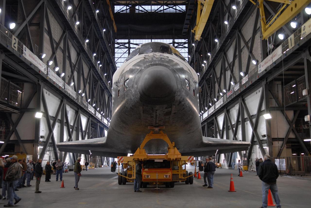 KENNEDY SPACE CENTER, FLA. --  The orbiter Atlantis, on top of its transporter, comes to a stop in the transfer aisle of the Vehicle Assembly Building after the rollover from the Orbiter Processing Facility.  First motion out of OPF was at 6:19 a.m. EST.  Once in the VAB, Atlantis will be lifted into high bay 1 and mated with the external tank and solid rocket boosters already in place on the mobile launcher platform. The rollover signals the start of the journey to the launch pad for liftoff on mission STS-117 targeted for March 15.  The mission is the 21st to the International Space Station and will deliver the S3/S4 starboard truss segments.  Photo credit: NASA/Kim Shiflett
