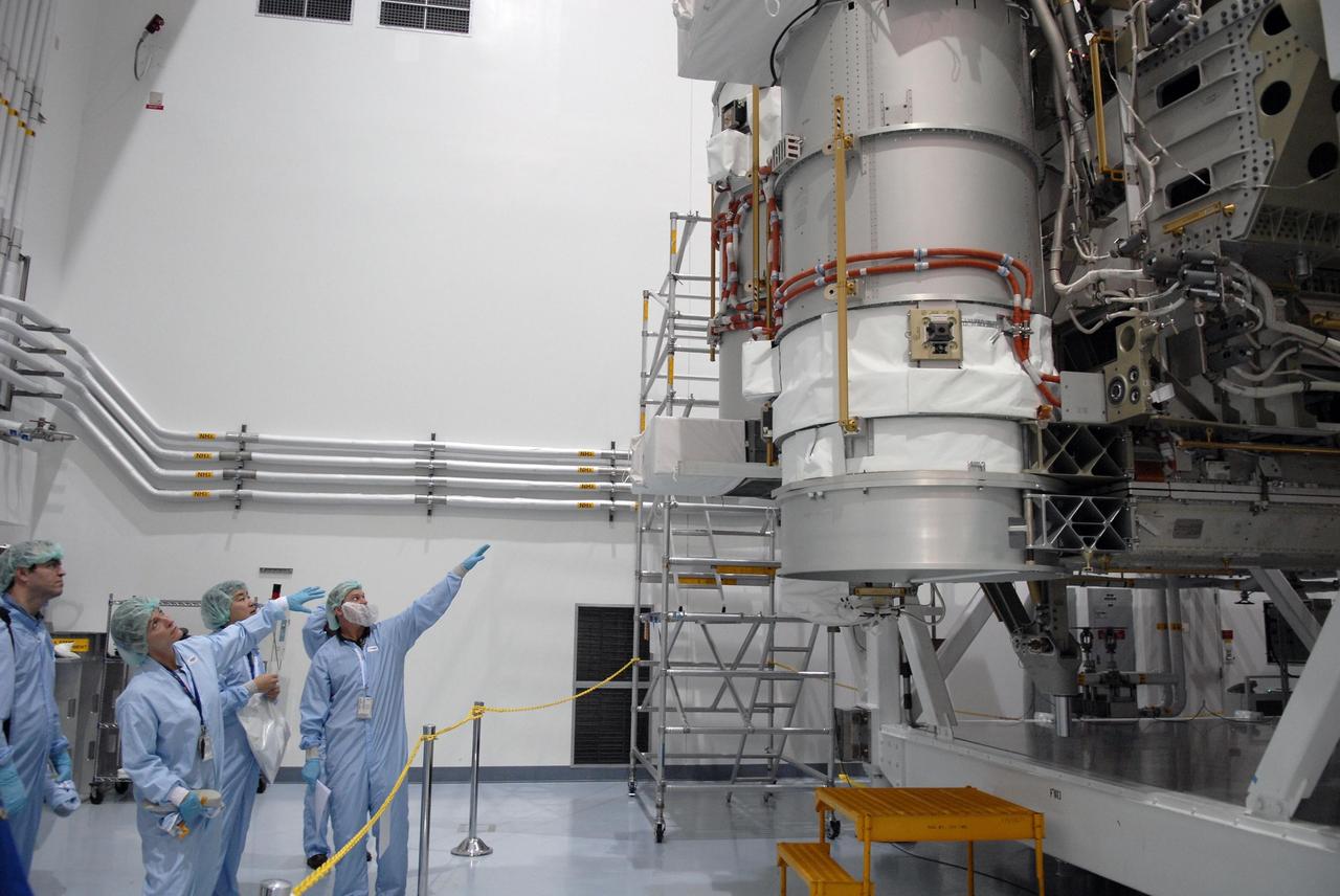 KENNEDY SPACE CENTER, FLA. -- From the floor of the Space Station Processing Facility, astronauts get a look at the S6 integrated truss and solar arrays, scheduled to fly on STS-119 in 2008.  In the center are Peggy Whitson and Dan Tani.  With construction of the Space Station the primary focus of future shuttle missions, astronaut crews will be working with one or more of the elements and hardware already being processed in the SSPF.  Photo credit: NASA/Kim Shiflett