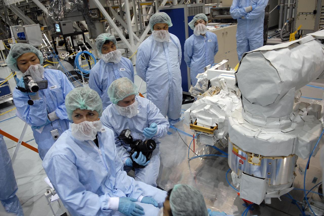 KENNEDY SPACE CENTER, FLA. -- In the Space Station Processing Facility, astronauts familiarize themselves with hardware and modules to be flown on upcoming shuttle flights. In the front is Peggy Whitson, looking at the Japanese remote manipulator system, part of the payload on a 2008 mission. With construction of the Space Station the primary focus of future shuttle missions, astronaut crews will be working with one or more of the elements and hardware already being processed in the SSPF. Photo credit: NASA/Kim Shiflett
