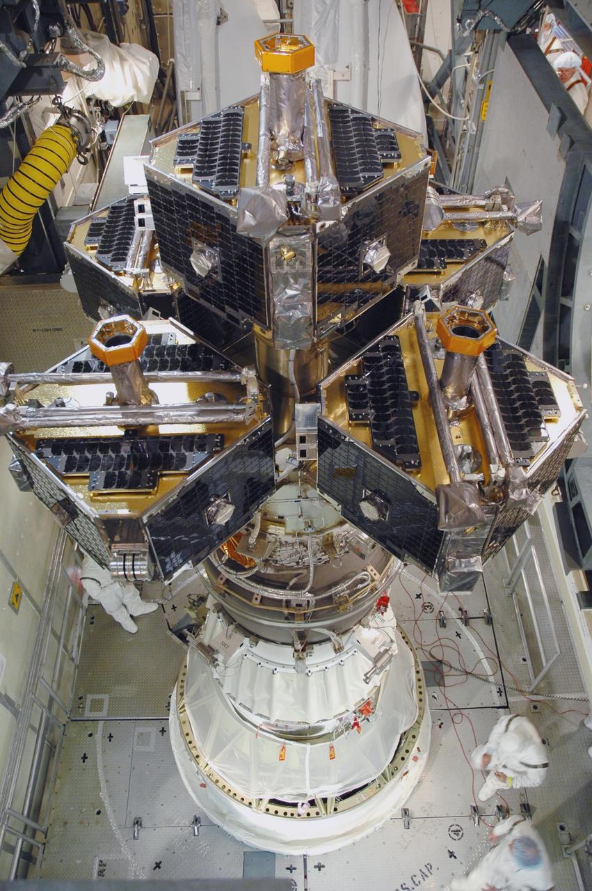 KENNEDY SPACE CENTER, FLA. --  In the mobile service tower on Pad 17-B at Cape Canaveral Air Force Station, the THEMIS spacecraft is being prepared for installation of the fairing.  The fairing is a molded structure that fits flush with the outside surface of the Delta II upper stage booster and forms an aerodynamically smooth nose cone, protecting the spacecraft during launch and ascent. THEMIS is an acronym for Time History of Events and Macroscale Interactions during Substorms.  THEMIS consists of five identical probes that will track violent, colorful eruptions near the North Pole.  This will be the largest number of scientific satellites NASA ever launched into orbit aboard a single rocket.  The THEMIS mission aims to unravel the tantalizing mystery behind auroral substorms, an avalanche of magnetic energy powered by the solar wind that intensifies the northern and southern lights.  The mission will investigate what causes auroras in the Earth’s atmosphere to dramatically change from slowly shimmering waves of light to wildly shifting streaks of bright color.  Launch of THEMIS is scheduled for Feb. 15 aboard a Delta II rocket, with the launch service being conducted by the United Launch Alliance.  Photo credit: NASA/Jim Grossmann