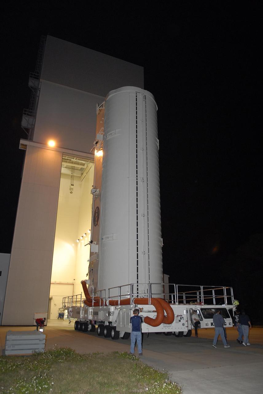 KENNEDY SPACE CENTER, FLA. --  The payload canister on its transporter leaves the Canister Rotation Facility at NASA's Kennedy Space Center, heading for Launch Pad 39A.  The canister contains the S3/S4 integrated truss for mission STS-117 to the International Space Station aboard Space Shuttle Atlantis.   The Atlantis crew will install the new truss segment, retract a set of solar arrays and unfold a new set on the starboard side of the station. Launch is targeted for March 15.  Photo credit: NASA/Kim Shiflett