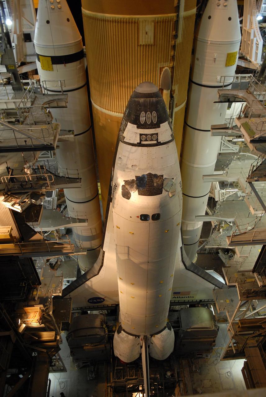 KENNEDY SPACE CENTER, FLA. -- Space Shuttle Atlantis is poised inside the Vehicle Assembly Building to begin its slow rollout to Launch Pad 39A. A shuttle comprises the orbiter, external tank and twin solid rocket boosters. The 3.4-mile trip along the crawlerway will take about 6 hours. The mission payload aboard Space Shuttle Atlantis is the S3/S4 integrated truss structure, along with a third set of solar arrays and batteries. The crew of six astronauts will install the truss to continue assembly of the International Space Station. Launch is targeted for March 15. Photo credit: NASA/Kim Shiflett