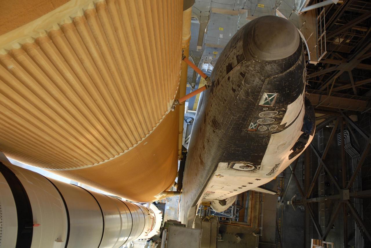KENNEDY SPACE CENTER, FLA. -- Viewed from above, Space Shuttle Atlantis begins moving through the open door of the Vehicle Assembly Building for the rollout to Launch Pad 39A. First motion was at 8:19 a.m. The 3.4-mile trip along the crawlerway will take about 6 hours. The mission payload aboard Space Shuttle Atlantis is the S3/S4 integrated truss structure, along with a third set of solar arrays and batteries. The crew of six astronauts will install the truss to continue assembly of the International Space Station. Launch is targeted for March 15. Photo credit: NASA/Kim Shiflett