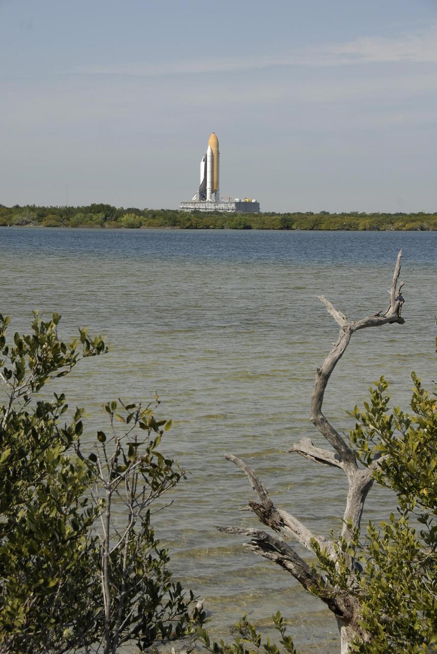KENNEDY SPACE CENTER, FLA. -- In the clear morning light, Space Shuttle Atlantis, atop the mobile launcher platform and crawler-transporter, slowly makes its way to Launch Pad 39A. First motion out of the Vehicle Assembly Building was at 8:19 a.m. The 3.4-mile trip to the pad along the crawlerway will take about 6 hours. The mission payload aboard Space Shuttle Atlantis is the S3/S4 integrated truss structure, along with a third set of solar arrays and batteries. The crew of six astronauts will install the truss to continue assembly of the International Space Station. Launch is targeted for March 15. Photo credit: NASA/Kim Shiflett