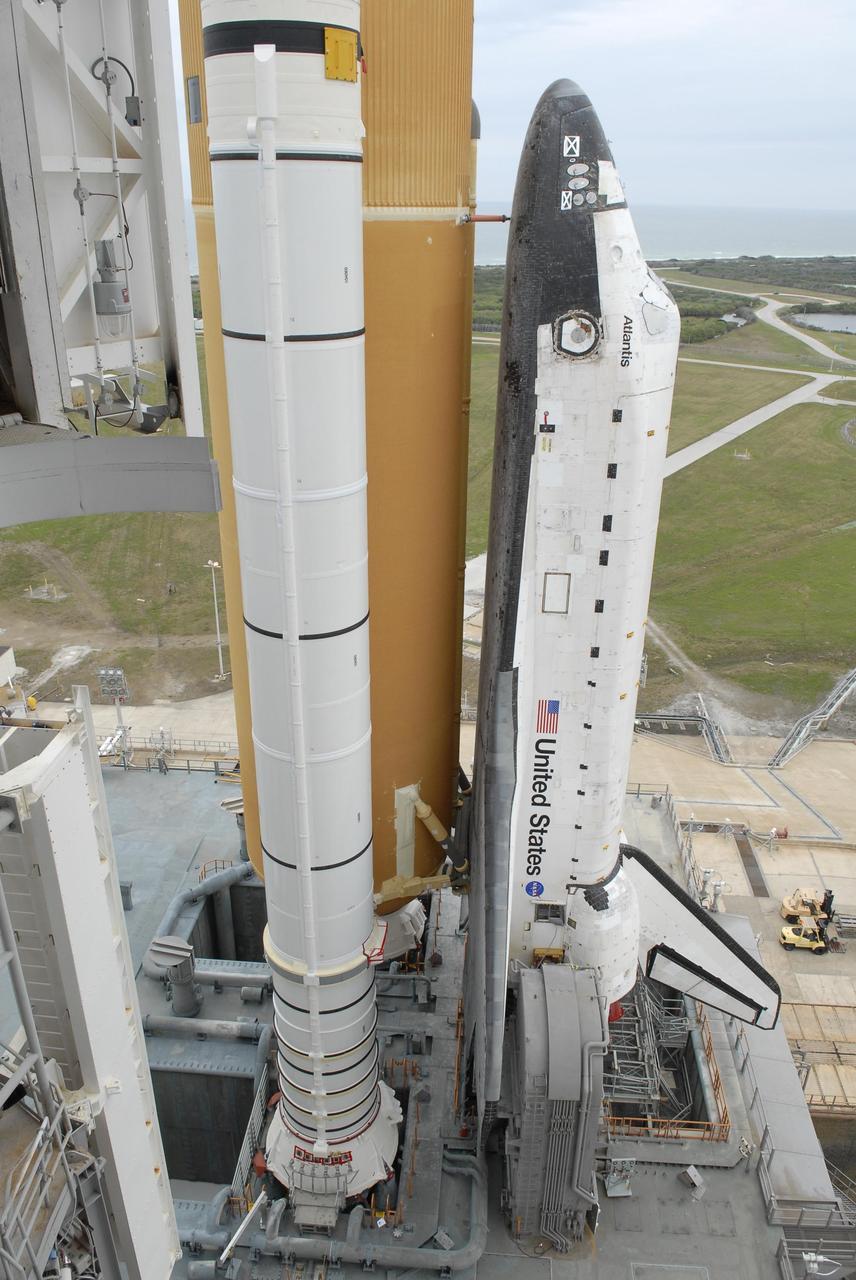 KENNEDY SPACE CENTER, FLA. -- Space Shuttle Atlantis arrives on the hardstand on Launch Pad 39A after a six-hour trek, via the crawler-transporter, from the Vehicle Assembly Building. The first motion out of the assembly building was at 8:19 a.m. The mission payload aboard Space Shuttle Atlantis is the S3/S4 integrated truss structure, along with a third set of solar arrays and batteries. The crew of six astronauts will install the truss to continue assembly of the International Space Station. Launch is targeted for March 15. Photo credit: NASA/Kim Shiflett