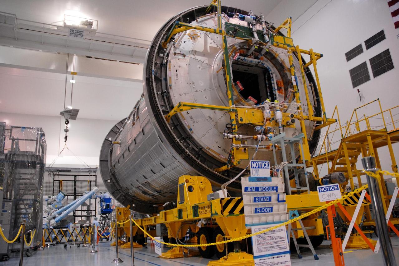 KENNEDY SPACE CENTER, FLA. -- Inside the Space Station Processing Facility at Kennedy Space Center, workers prepare the Remote Manipulator System, or robotic arm, for installation on the Japanese Experiment Module for testing.  The RMS is one of the payloads scheduled to be delivered to the station on a future mission tentatively scheduled for 2008.  The RMS is similar to the robotic arm already installed on the station's mobile base system.  Photo credit: NASA/Amanda Diller