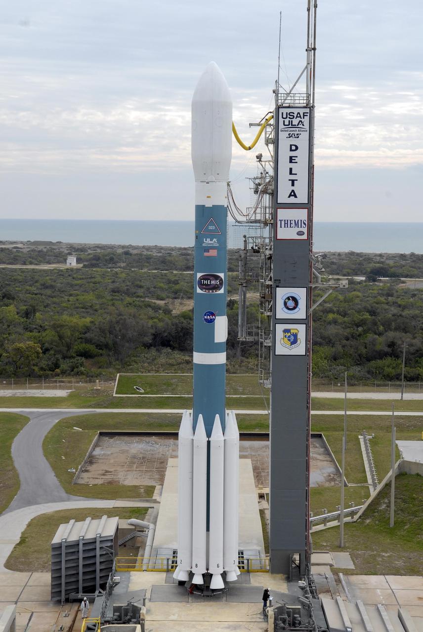 KENNEDY SPACE CENTER, FLA. -- The Delta II rocket with the THEMIS spacecraft atop sits ready for launch on Pad 17-B at Cape Canaveral Air Force Station after the mobile service tower moves away from the pad.  THEMIS, an acronym for Time History of Events and Macroscale Interactions during Substorms, consists of five identical probes that will track violent, colorful eruptions near the North Pole.  This will be the largest number of scientific satellites NASA has ever launched into orbit aboard a single rocket.  The THEMIS mission aims to unravel the mystery behind auroral substorms, an avalanche of magnetic energy powered by the solar wind that intensifies the northern and southern lights.  The mission will investigate what causes auroras in the Earth’s atmosphere to dramatically change from slowly shimmering waves of light to wildly shifting streaks of bright color.  Launch is scheduled for 6:05 p.m.  Photo credit: NASA/Kim Shiflett