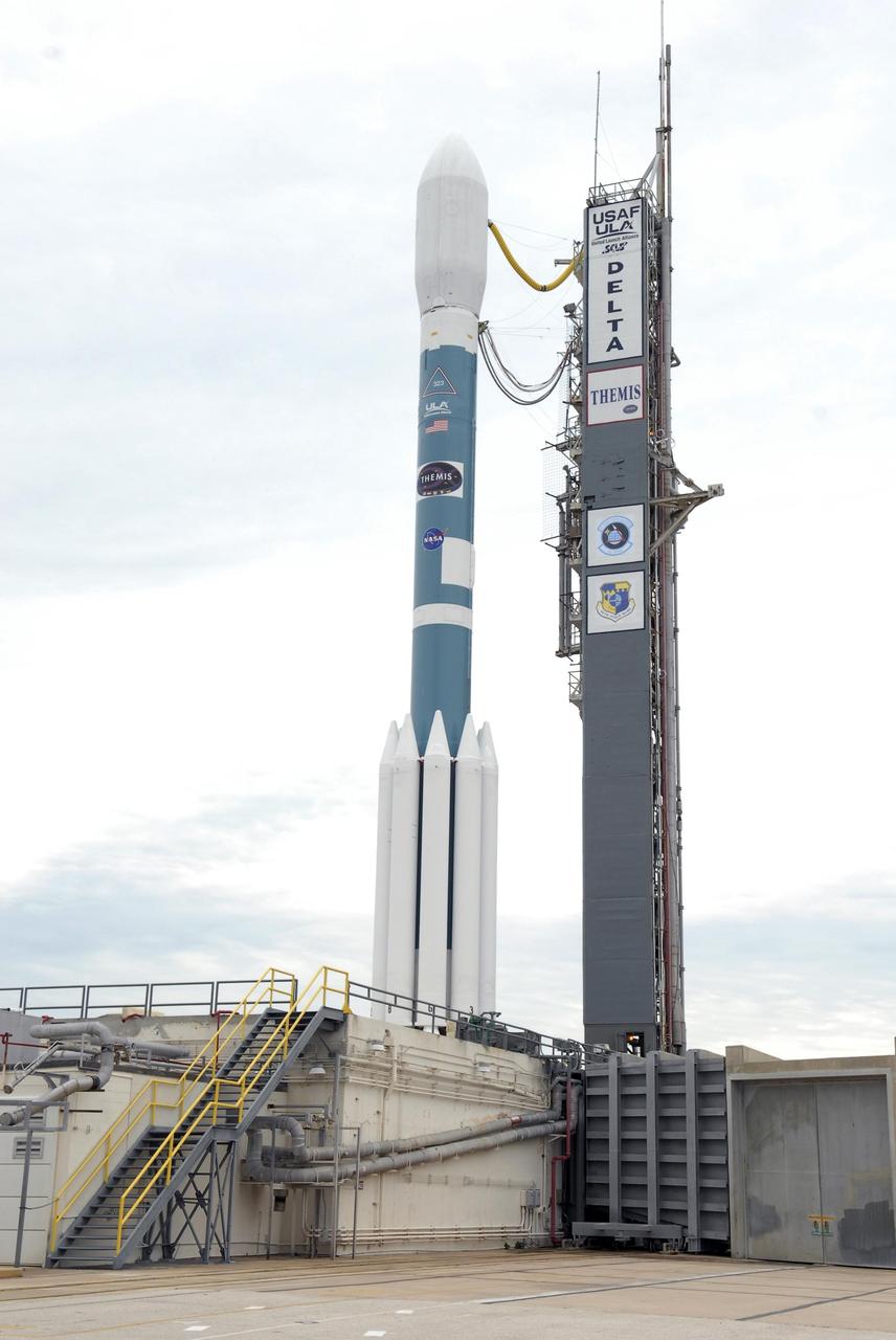 KENNEDY SPACE CENTER, FLA. -- The Delta II rocket with the THEMIS spacecraft atop sits ready for launch on Pad 17-B at Cape Canaveral Air Force Station after the mobile service tower moves away from the pad.  THEMIS, an acronym for Time History of Events and Macroscale Interactions during Substorms, consists of five identical probes that will track violent, colorful eruptions near the North Pole.  This will be the largest number of scientific satellites NASA has ever launched into orbit aboard a single rocket.  The THEMIS mission aims to unravel the mystery behind auroral substorms, an avalanche of magnetic energy powered by the solar wind that intensifies the northern and southern lights.  The mission will investigate what causes auroras in the Earth’s atmosphere to dramatically change from slowly shimmering waves of light to wildly shifting streaks of bright color.  Launch is scheduled for 6:05 p.m.  Photo credit: NASA/Kim Shiflett