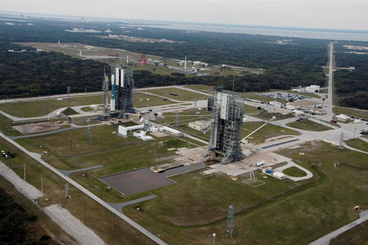 KENNEDY SPACE CENTER, FLA. -- The Delta II rocket with the THEMIS spacecraft atop sits ready for launch on Pad 17-B at Cape Canaveral Air Force Station in this aerial view of the launch complex area as the mobile service tower begins to move away.  THEMIS, an acronym for Time History of Events and Macroscale Interactions during Substorms, consists of five identical probes that will track violent, colorful eruptions near the North Pole.  This will be the largest number of scientific satellites NASA has ever launched into orbit aboard a single rocket.  The THEMIS mission aims to unravel the mystery behind auroral substorms, an avalanche of magnetic energy powered by the solar wind that intensifies the northern and southern lights.  The mission will investigate what causes auroras in the Earth’s atmosphere to dramatically change from slowly shimmering waves of light to wildly shifting streaks of bright color.  Launch is scheduled for 6:05 p.m.  Photo credit: NASA/George Shelton