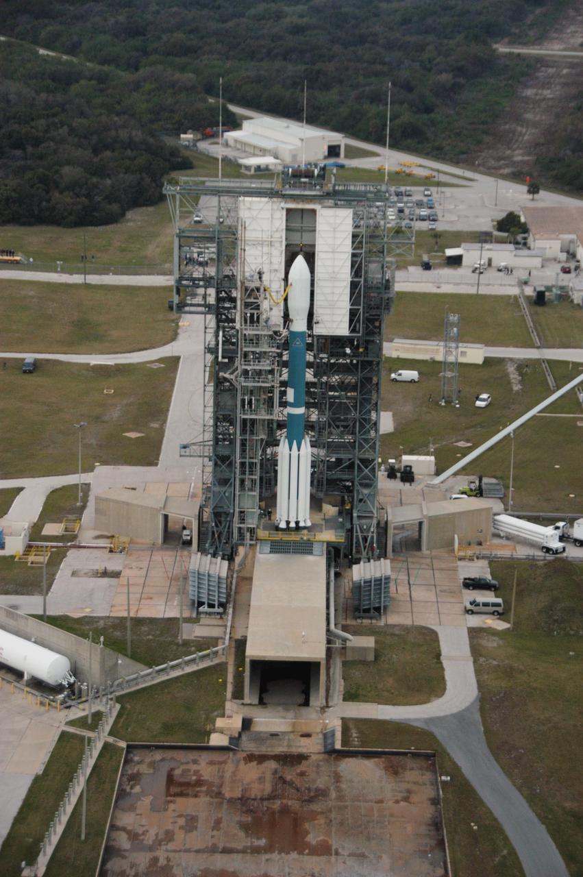 KENNEDY SPACE CENTER, FLA. -- In this close-up aerial view, the Delta II rocket with the THEMIS spacecraft atop sits ready for launch on Pad 17-B at Cape Canaveral Air Force Station as the mobile service tower begins to move away.  THEMIS, an acronym for Time History of Events and Macroscale Interactions during Substorms, consists of five identical probes that will track violent, colorful eruptions near the North Pole.  This will be the largest number of scientific satellites NASA has ever launched into orbit aboard a single rocket.  The THEMIS mission aims to unravel the mystery behind auroral substorms, an avalanche of magnetic energy powered by the solar wind that intensifies the northern and southern lights.  The mission will investigate what causes auroras in the Earth’s atmosphere to dramatically change from slowly shimmering waves of light to wildly shifting streaks of bright color.  Launch is scheduled for 6:05 p.m.  Photo credit: NASA/George Shelton