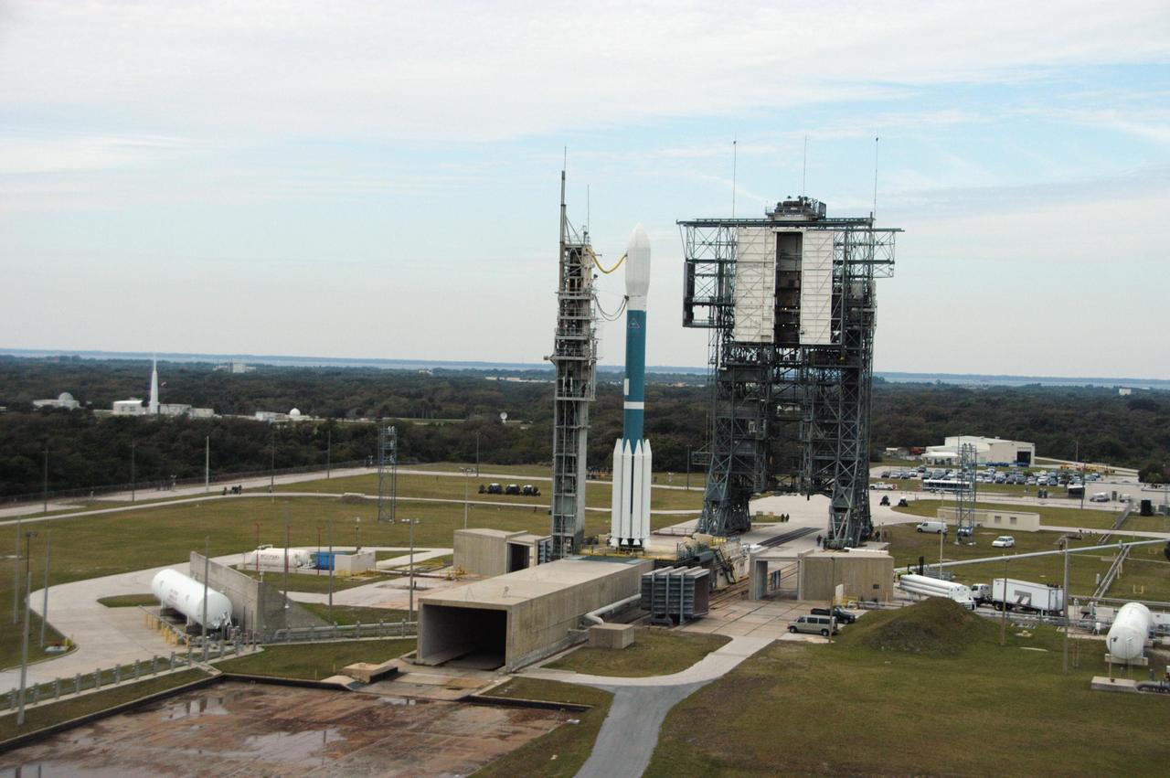 KENNEDY SPACE CENTER, FLA. -- In this aerial view, the Delta II rocket with the THEMIS spacecraft sits ready for launch on Pad 17-B at Cape Canaveral Air Force Station, as the mobile service tower moves away from the pad.  THEMIS, an acronym for Time History of Events and Macroscale Interactions during Substorms, consists of five identical probes that will track violent, colorful eruptions near the North Pole.  This will be the largest number of scientific satellites NASA has ever launched into orbit aboard a single rocket.  The THEMIS mission aims to unravel the mystery behind auroral substorms, an avalanche of magnetic energy powered by the solar wind that intensifies the northern and southern lights.  The mission will investigate what causes auroras in the Earth’s atmosphere to dramatically change from slowly shimmering waves of light to wildly shifting streaks of bright color.  Launch is scheduled for 6:05 p.m.  Photo credit: NASA/George Shelton