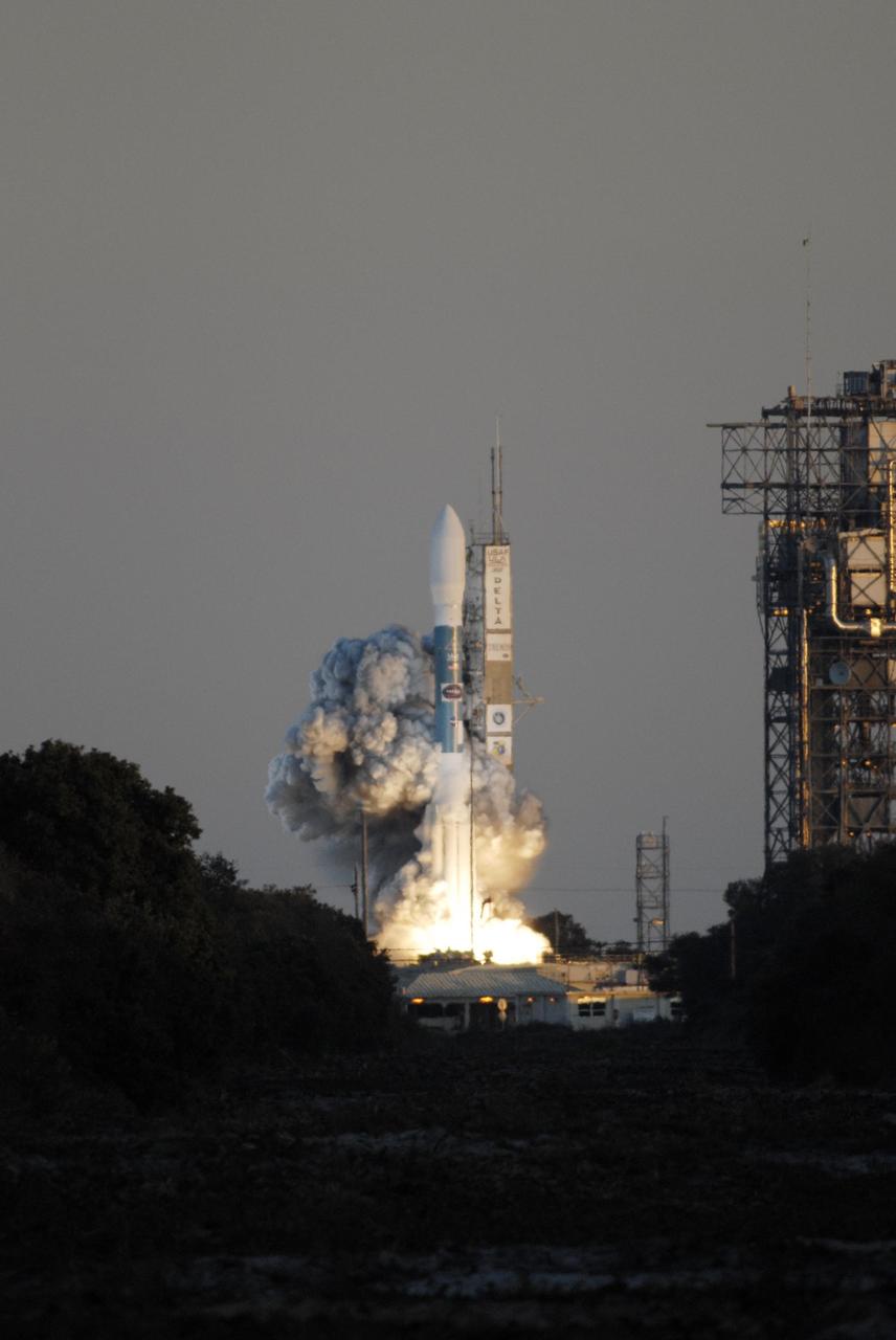 KENNEDY SPACE CENTER, FLA. -- Amid billows of smoke, the Delta II rocket with NASA's THEMIS spacecraft aboard lifts off Pad 17-B at Cape Canaveral Air Force Station at 6:01 p.m. EST. THEMIS, an acronym for Time History of Events and Macroscale Interactions during Substorms, consists of five identical probes that will track violent, colorful eruptions near the North Pole.  This will be the largest number of scientific satellites NASA has ever launched into orbit aboard a single rocket.  The THEMIS mission aims to unravel the mystery behind auroral substorms, an avalanche of magnetic energy powered by the solar wind that intensifies the northern and southern lights.  The mission will investigate what causes auroras in the Earth’s atmosphere to dramatically change from slowly shimmering waves of light to wildly shifting streaks of bright color. Photo credit: NASA/Kim Shiflett