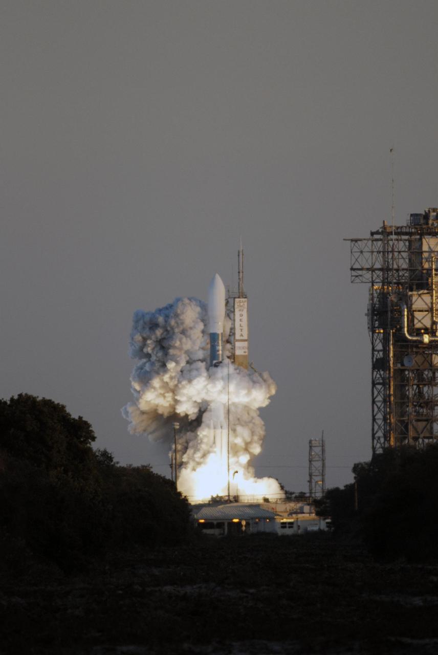 KENNEDY SPACE CENTER, FLA. -- Amid billows of smoke, the Delta II rocket with NASA's THEMIS spacecraft aboard lifts off Pad 17-B at Cape Canaveral Air Force Station at 6:01 p.m. EST. THEMIS, an acronym for Time History of Events and Macroscale Interactions during Substorms, consists of five identical probes that will track violent, colorful eruptions near the North Pole.  This will be the largest number of scientific satellites NASA has ever launched into orbit aboard a single rocket.  The THEMIS mission aims to unravel the mystery behind auroral substorms, an avalanche of magnetic energy powered by the solar wind that intensifies the northern and southern lights.  The mission will investigate what causes auroras in the Earth’s atmosphere to dramatically change from slowly shimmering waves of light to wildly shifting streaks of bright color. Photo credit: NASA/Kim Shiflett