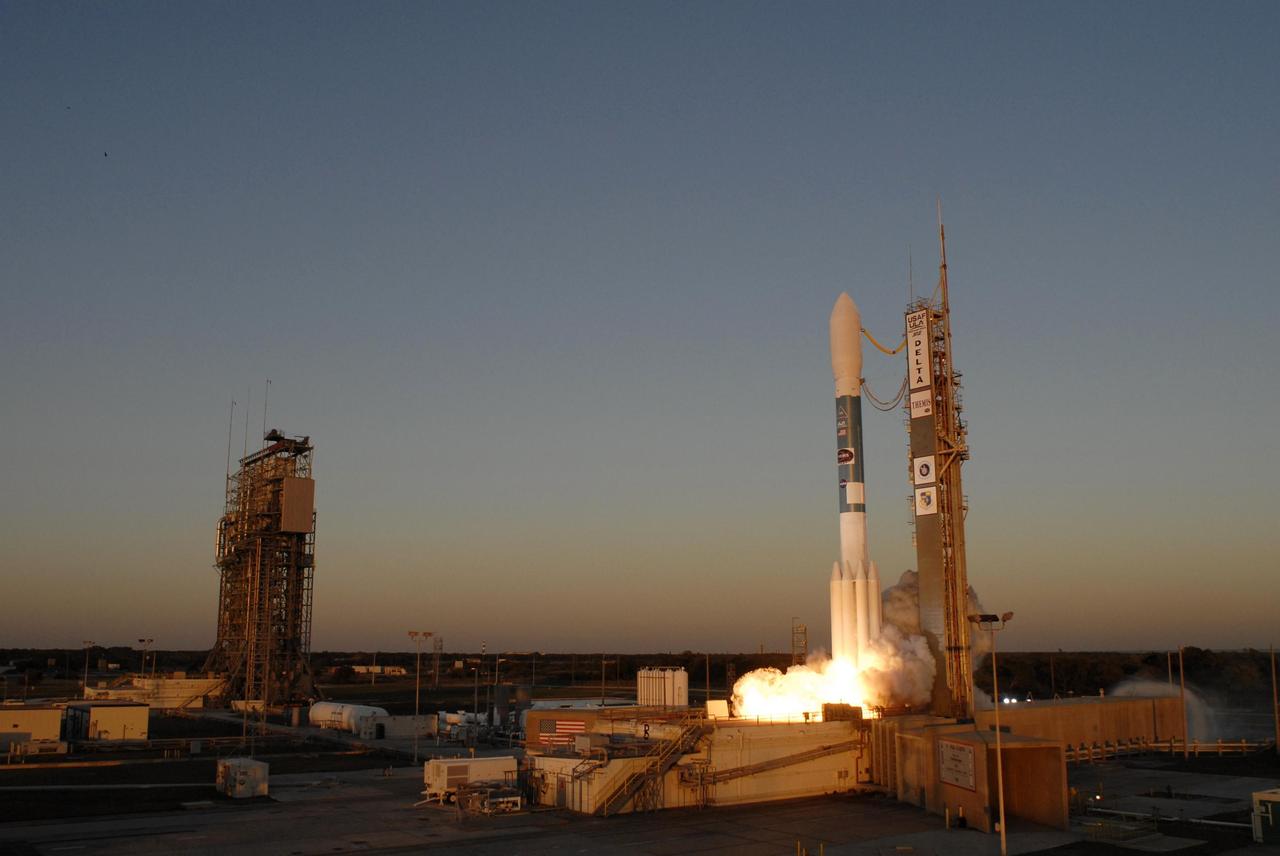 KENNEDY SPACE CENTER, FLA. -- At Cape Canaveral Air Force Station, the Delta II rocket with NASA's THEMIS spacecraft aboard begins its ascent from Pad 17-B on a crisp Florida evening at 6:01 p.m. EST. THEMIS, an acronym for Time History of Events and Macroscale Interactions during Substorms, consists of five identical probes that will track violent, colorful eruptions near the North Pole.  This will be the largest number of scientific satellites NASA has ever launched into orbit aboard a single rocket.  The THEMIS mission aims to unravel the mystery behind auroral substorms, an avalanche of magnetic energy powered by the solar wind that intensifies the northern and southern lights.  The mission will investigate what causes auroras in the Earth’s atmosphere to dramatically change from slowly shimmering waves of light to wildly shifting streaks of bright color. Photo credit: NASA/Sandra Joseph, Ralph Hernandez