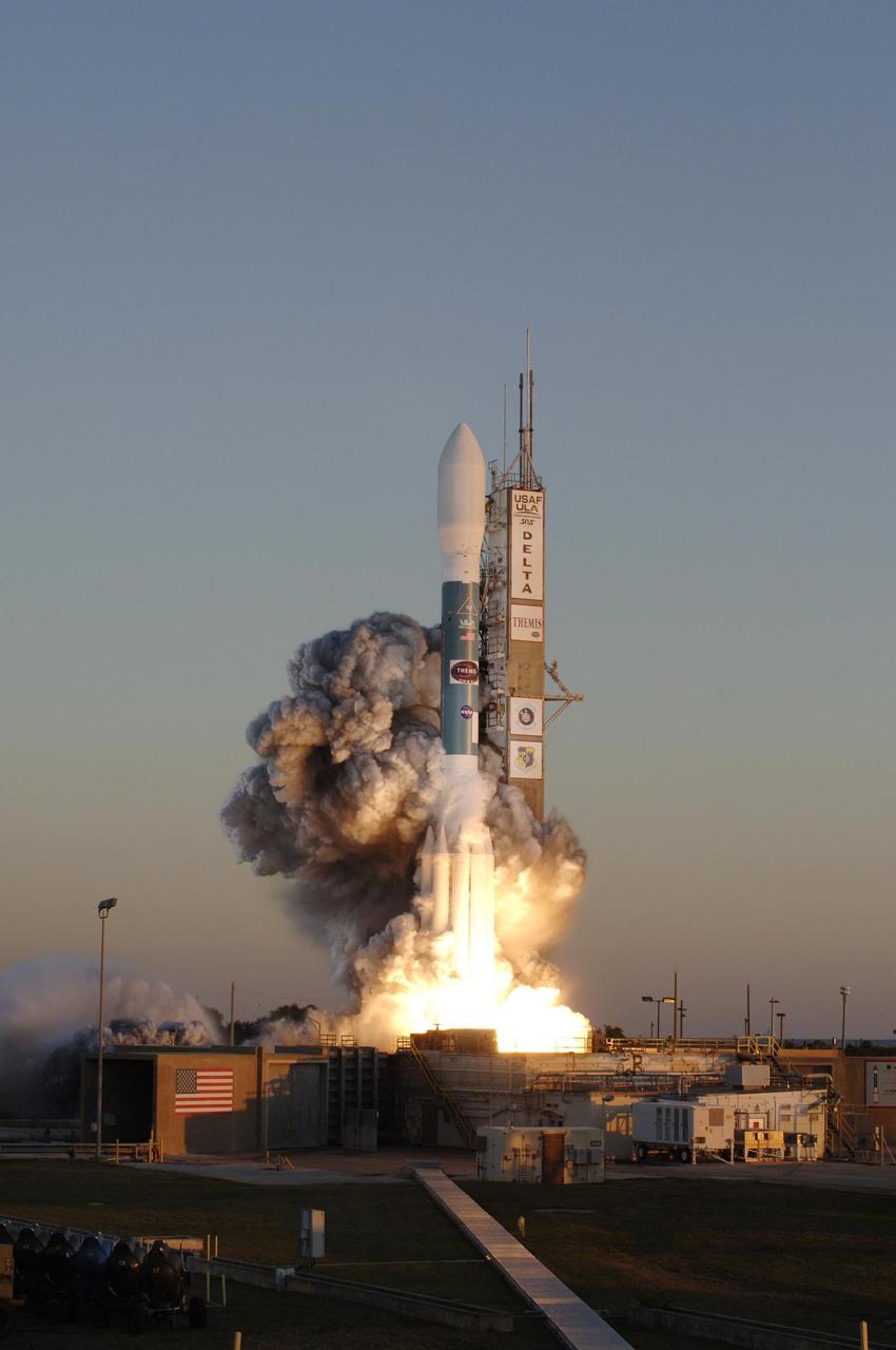 KENNEDY SPACE CENTER, FLA. -- Amid billows of smoke, the Delta II rocket with NASA's THEMIS spacecraft aboard blasts off Pad 17-B at Cape Canaveral Air Force Station at 6:01 p.m. EST. THEMIS, an acronym for Time History of Events and Macroscale Interactions during Substorms, consists of five identical probes that will track violent, colorful eruptions near the North Pole.  This will be the largest number of scientific satellites NASA has ever launched into orbit aboard a single rocket.  The THEMIS mission aims to unravel the mystery behind auroral substorms, an avalanche of magnetic energy powered by the solar wind that intensifies the northern and southern lights.  The mission will investigate what causes auroras in the Earth’s atmosphere to dramatically change from slowly shimmering waves of light to wildly shifting streaks of bright color. Photo credit: NASA/Jerry Cannon