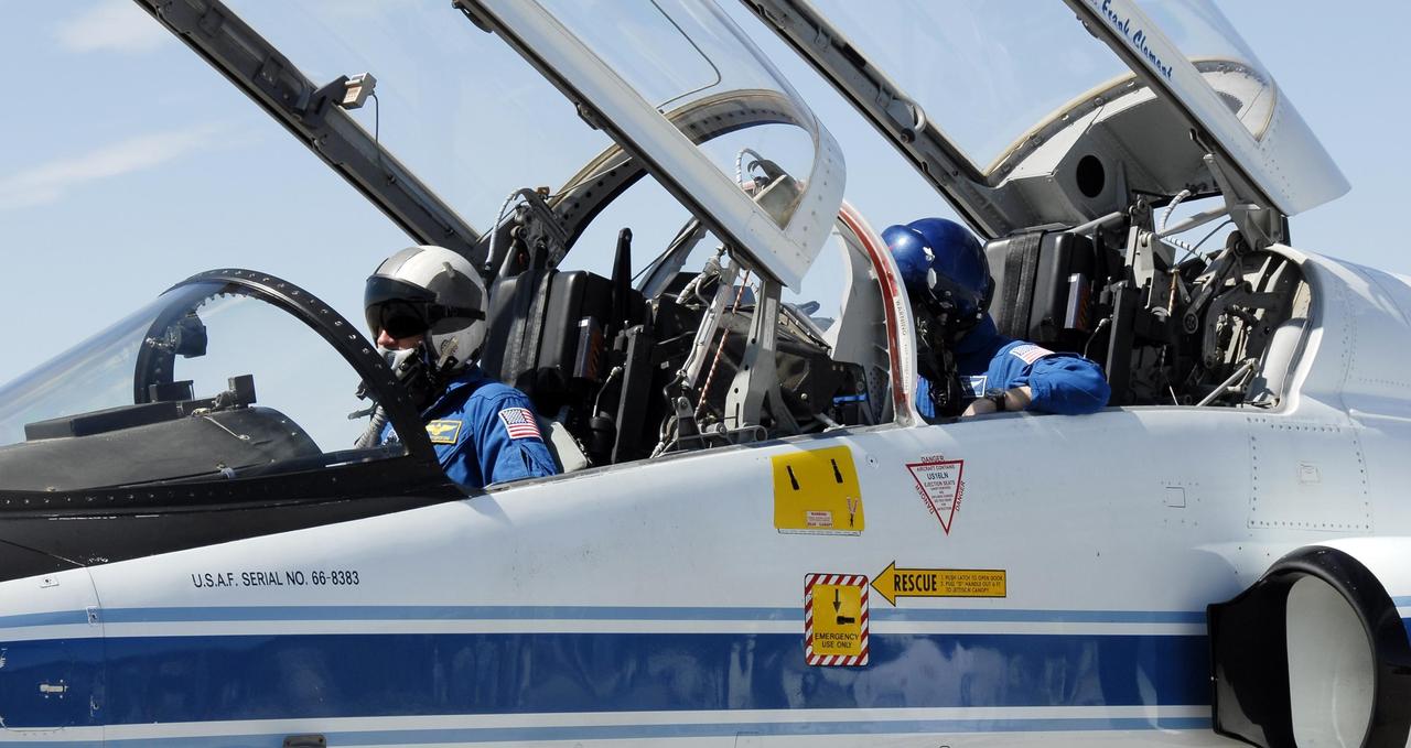 KENNEDY SPACE CENTER, FLA. -- The STS-117 crew arrives at NASA's Kennedy Space Center to take part in the Terminal Countdown Demonstration Test (TCDT), a preparation for the launch March 15 to the International Space Station. Seen here is Commander Rick Sturckow in front and Mission Specialist Patrick Forrester in back in a T-38 jet aircraft. The TCDT includes emergency egress training and a simulated launch countdown. The mission payload aboard Space Shuttle Atlantis is the S3/S4 integrated truss structure, along with a third set of solar arrays and batteries. The crew of six astronauts will install the truss to continue assembly of the station. Photo credit: NASA/Kim Shiflett
