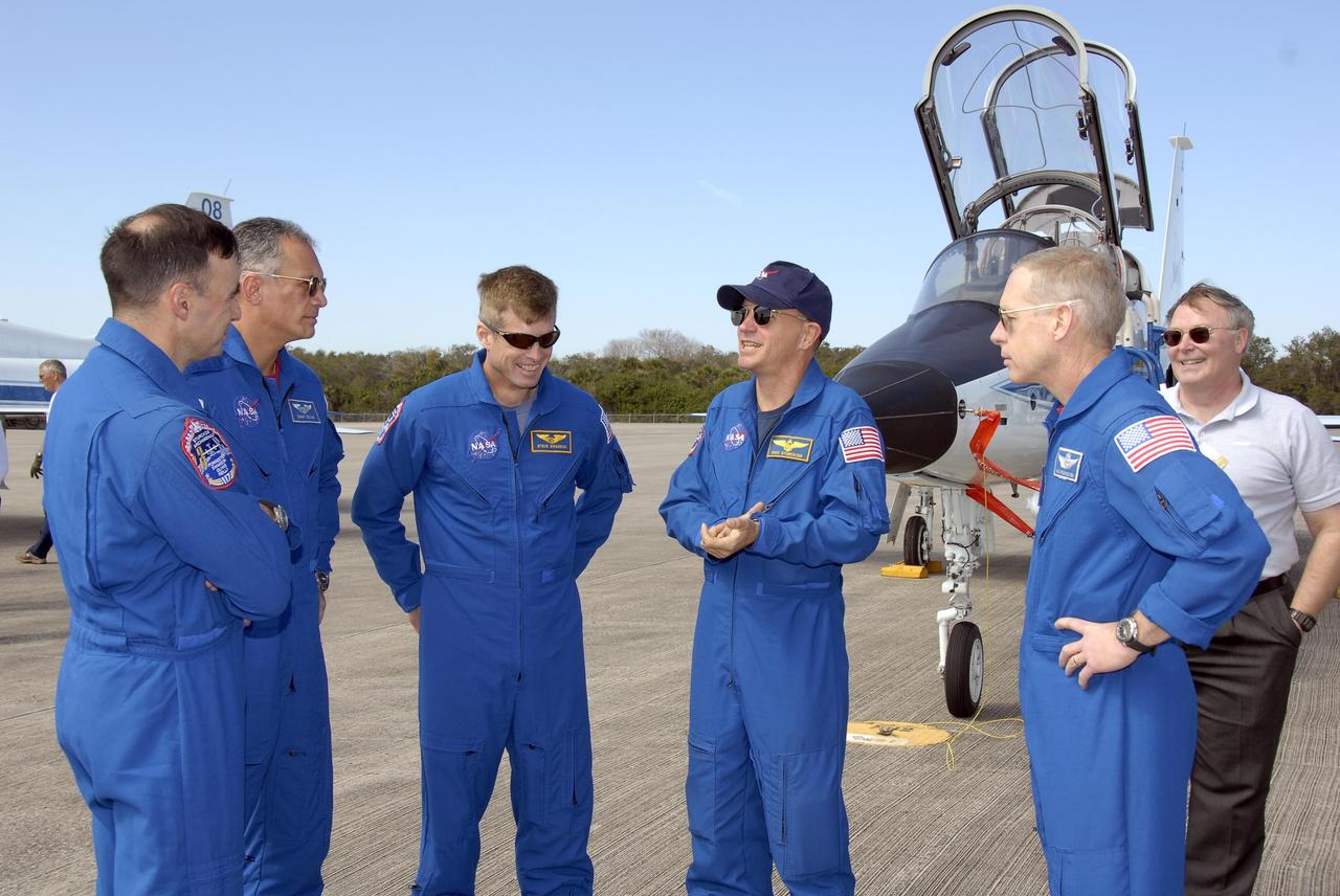 KENNEDY SPACE CENTER, FLA. -- The STS-117 crew arrives at NASA's Kennedy Space Center to take part in the Terminal Countdown Demonstration Test (TCDT), a preparation for the launch March 15 to the International Space Station. From left are Pilot Lee Archambault, Mission Specialists Danny Olivas and Steven Swanson, Commander Rick Sturckow, and Mission Specialist Patrick Forrester. The TCDT includes emergency egress training and a simulated launch countdown. The mission payload aboard Space Shuttle Atlantis is the S3/S4 integrated truss structure, along with a third set of solar arrays and batteries. The crew of six astronauts will install the truss to continue assembly of the station. Photo credit: NASA/Kim Shiflett