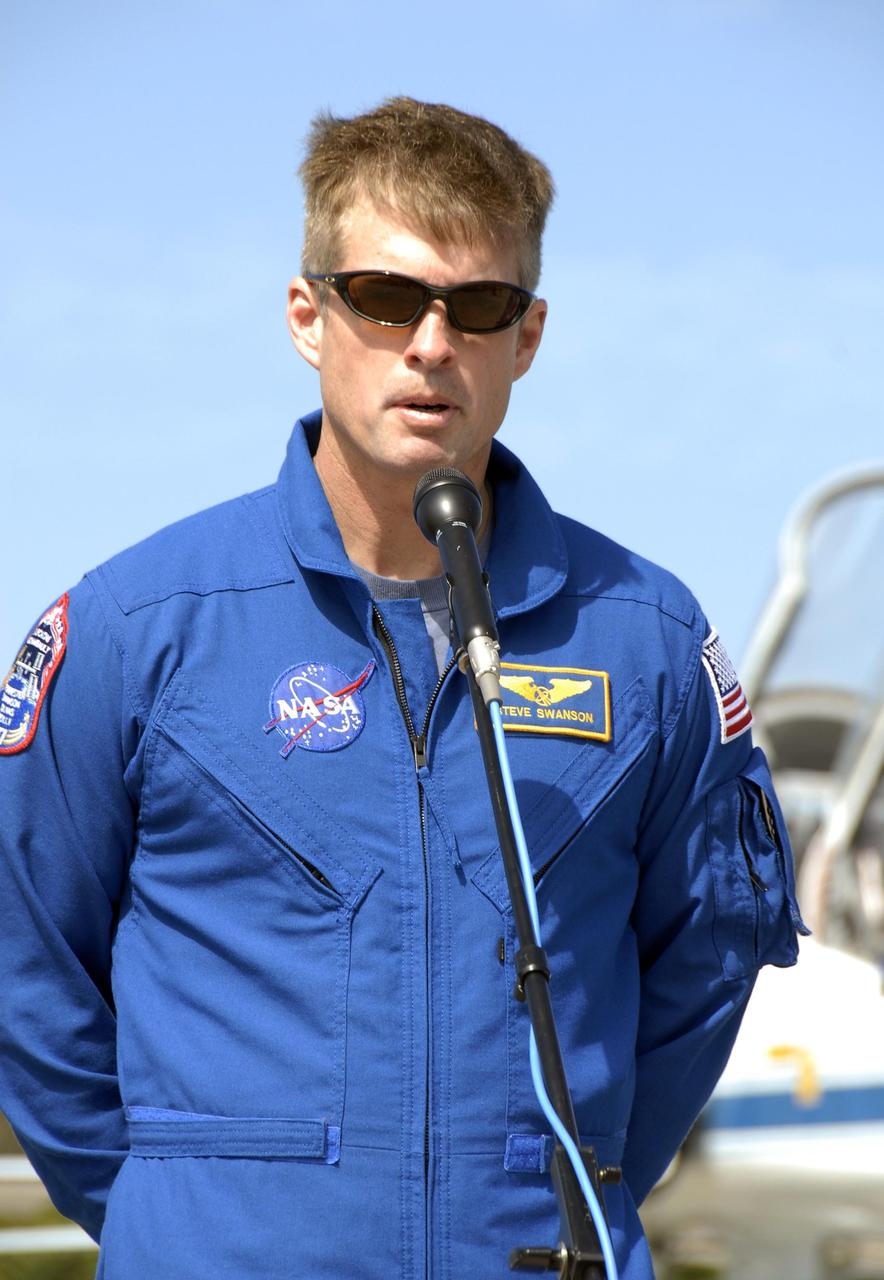KENNEDY SPACE CENTER, FLA. -- The STS-117 crew arrives at NASA's Kennedy Space Center to take part in the Terminal Countdown Demonstration Test (TCDT), a preparation for the launch March 15 to the International Space Station. Here, Mission Specialist Steven Swanson talks to members of the media at the Shuttle Landing Facility. The TCDT includes emergency egress training and a simulated launch countdown.The mission payload aboard Space Shuttle Atlantis is the S3/S4 integrated truss structure, along with a third set of solar arrays and batteries. The crew of six astronauts will install the truss to continue assembly of the station. Photo credit: NASA/Kim Shiflett