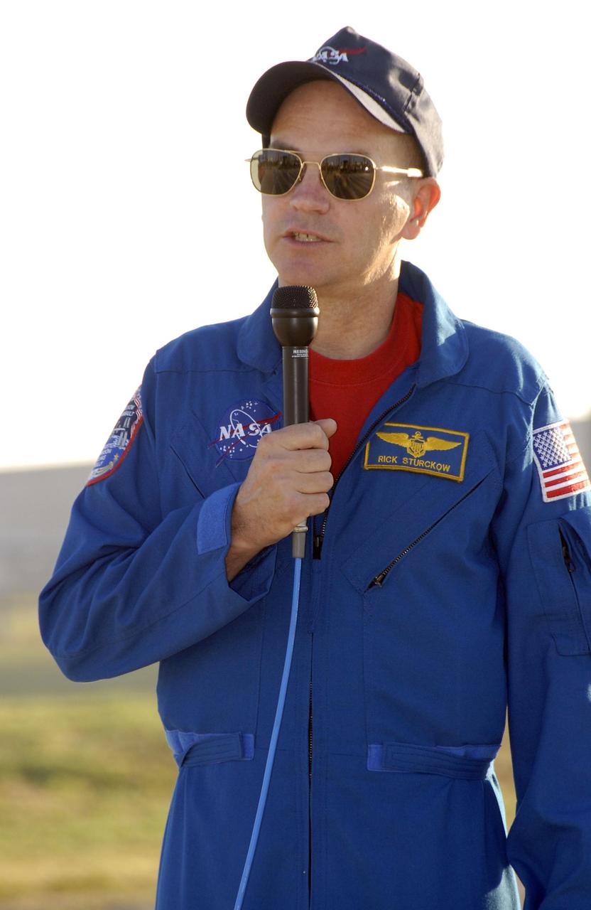 KENNEDY SPACE CENTER, FLA. -- Mission STS-117 Commander Rick Sturckow speaks to the media during a question-and-answer session at Launch Pad 39A during Terminal Countdown Demonstration Test (TCDT) activities. The TCDT also includes M-113 armored personnel carrier training, pad emergency egress training and a simulated launch countdown. The mission payload aboard Space Shuttle Atlantis is the S3/S4 integrated truss structure, along with a third set of solar arrays and batteries. The crew of six astronauts will install the truss to continue assembly of the International Space Station. Photo credit: NASA/Kim Shiflett