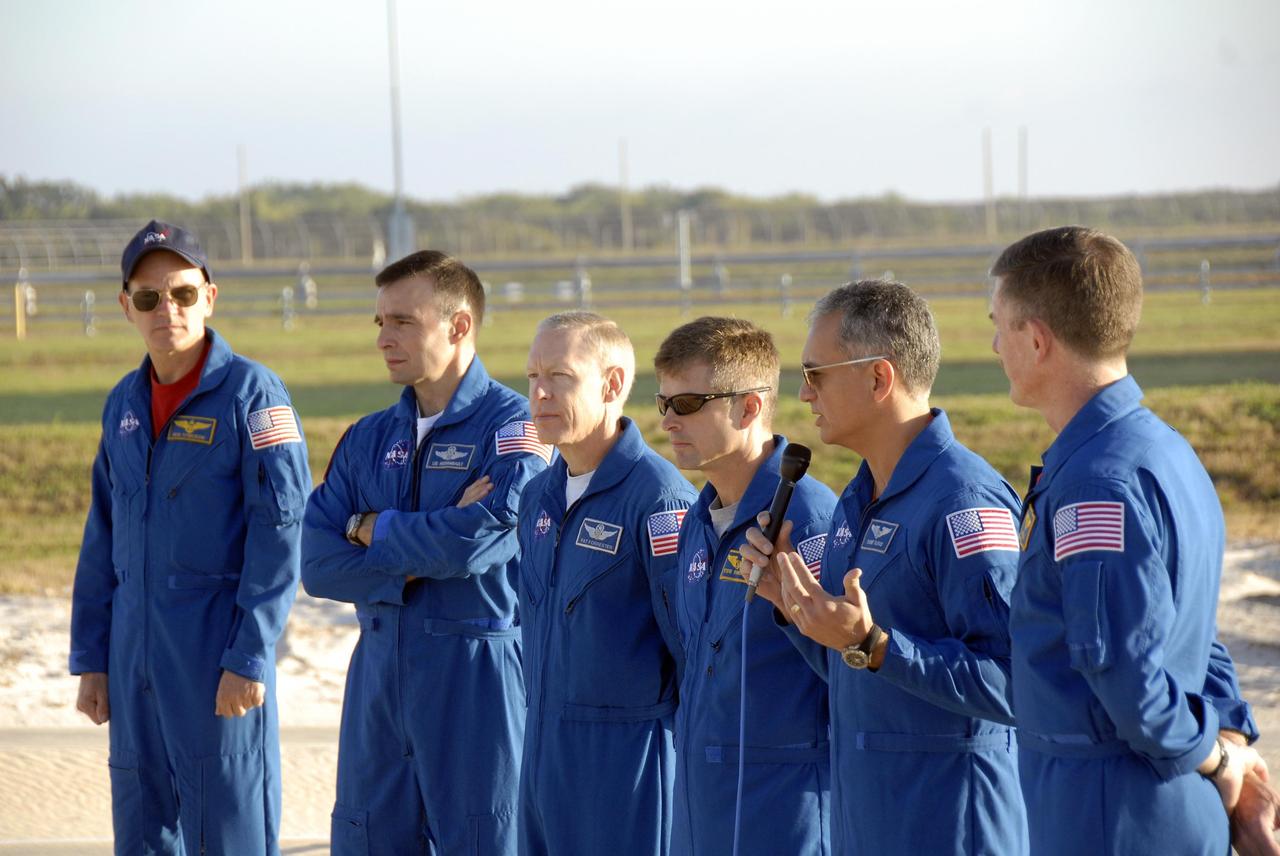 KENNEDY SPACE CENTER, FLA. --  During Terminal Countdown Demonstration Test (TCDT) activities at Launch Pad 39A, the Mission STS-117 crew members speak to the media during a question-and-answer session. From the left are Commander Rick Sturckow, Pilot Lee Archambault, and Mission Specialists Patrick Forrester, Steven Swanson, Danny Olivas and James Reilly.  The TCDT also includes M-113 armored personnel carrier training, pad emergency egress training and a simulated launch countdown. The mission payload aboard Space Shuttle Atlantis is the S3/S4 integrated truss structure, along with a third set of solar arrays and batteries. The crew of six astronauts will install the truss to continue assembly of the International Space Station. Photo credit: NASA/Kim Shiflett