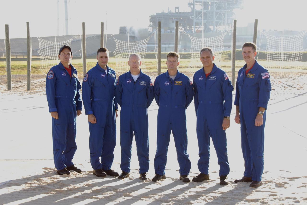 KENNEDY SPACE CENTER, FLA. --  During Terminal Countdown Demonstration Test (TCDT) activities at Launch Pad 39A, the Mission STS-117 crew members take time to speak to the media during a question-and-answer session. From the left are Commander Rick Sturckow, Pilot Lee Archambault, and Mission Specialists Patrick Forrester, Steven Swanson, Danny Olivas and James Reilly. The TCDT also includes M-113 armored personnel carrier training, pad emergency egress training and a simulated launch countdown. The mission payload aboard Space Shuttle Atlantis is the S3/S4 integrated truss structure, along with a third set of solar arrays and batteries. The crew of six astronauts will install the truss to continue assembly of the International Space Station. Photo credit: NASA/Kim Shiflett