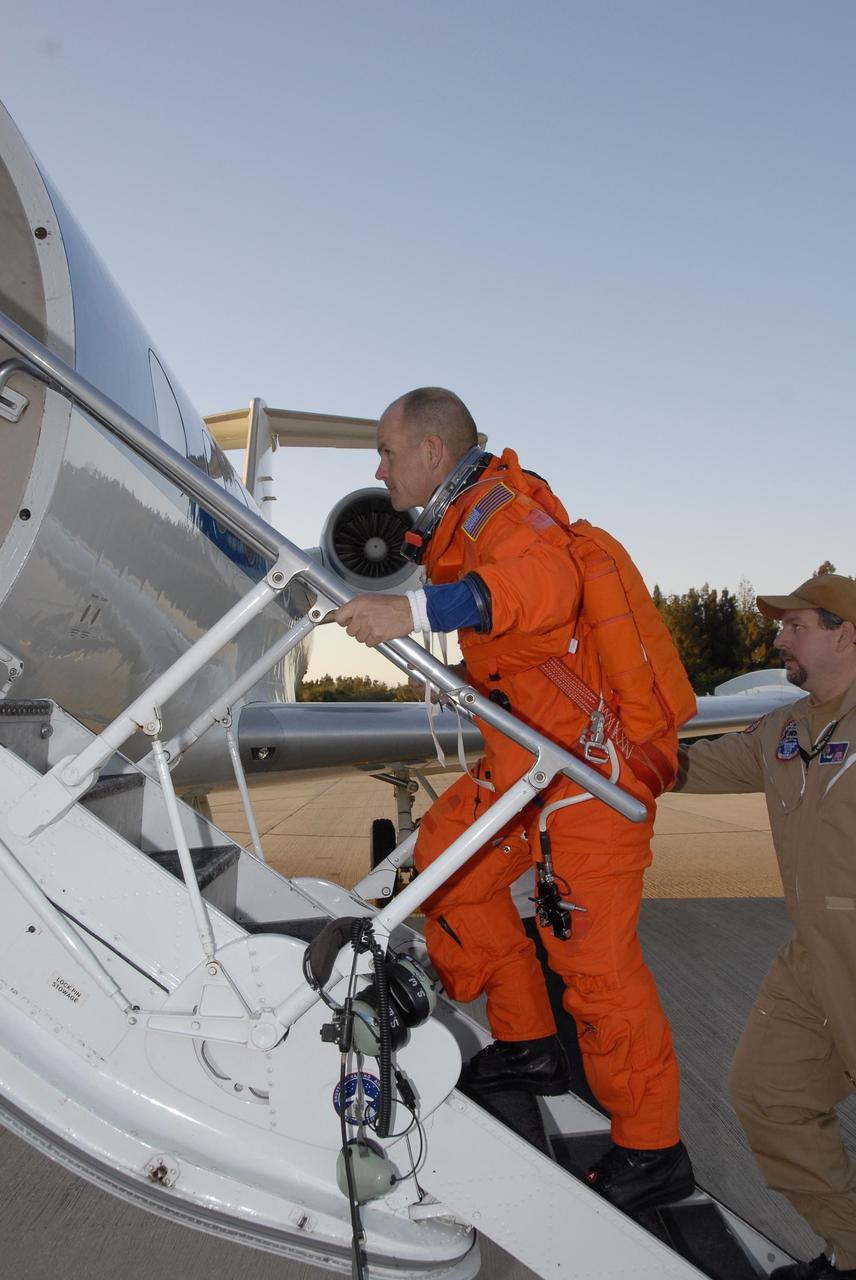 KENNEDY SPACE CENTER, FLA. --  At the Shuttle Landing Facility, Mission STS-117 Commander Rick Sturckow is ready to begin practice flights on the shuttle training aircraft (STA) during Terminal Countdown Demonstration Test (TCDT) Activities. The STA is a Grumman American Aviation-built Gulf Stream II jet that was modified to simulate an orbiter's cockpit, motion and visual cues, and handling qualities. In flight, the STA duplicates the orbiter's atmospheric descent trajectory from approximately 35,000 feet altitude to landing on a runway. Because the orbiter is unpowered during re-entry and landing, its high-speed glide must be perfectly executed the first time. The mission payload aboard Space Shuttle Atlantis is the S3/S4 integrated truss structure, along with a third set of solar arrays and batteries. The crew of six astronauts will install the truss to continue assembly of the International Space Station.  STS-117 is the 118th space shuttle flight and the 21st flight to the station. Photo credit: NASA/Kim Shiflett