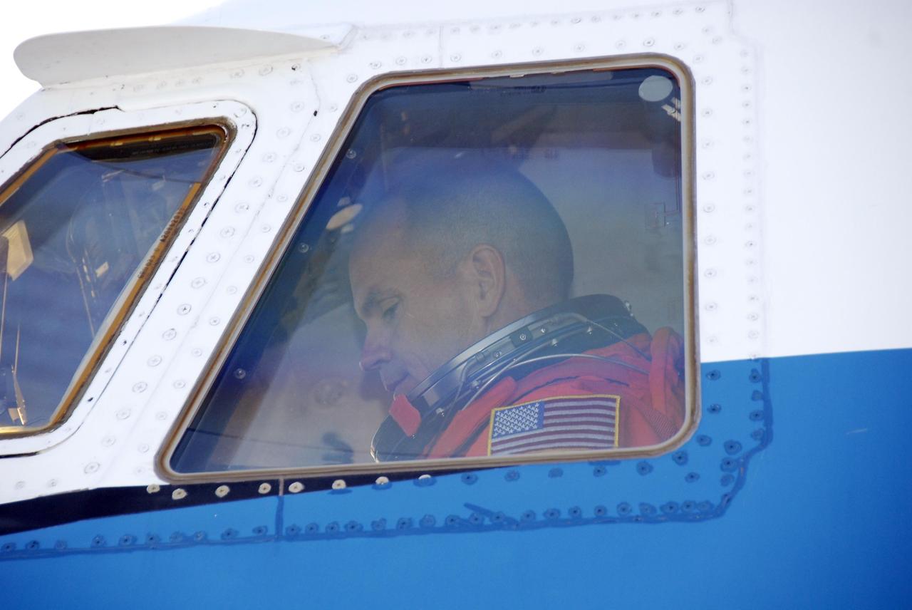 KENNEDY SPACE CENTER, FLA. --  At the Shuttle Landing Facility, Mission STS-117 Commander Rick Sturckow sits in the cockpit of the shuttle training aircraft (STA) ready to begin practice flights as part of the Terminal Countdown Demonstration Test (TCDT) activities. The STA is a Grumman American Aviation-built Gulf Stream II jet that was modified to simulate an orbiter's cockpit, motion and visual cues, and handling qualities. In flight, the STA duplicates the orbiter's atmospheric descent trajectory from approximately 35,000 feet altitude to landing on a runway. Because the orbiter is unpowered during re-entry and landing, its high-speed glide must be perfectly executed the first time. The mission payload aboard Space Shuttle Atlantis is the S3/S4 integrated truss structure, along with a third set of solar arrays and batteries. The crew of six astronauts will install the truss to continue assembly of the International Space Station.  STS-117 is the 118th space shuttle flight and the 21st flight to the station. Photo credit: NASA/Kim Shiflett