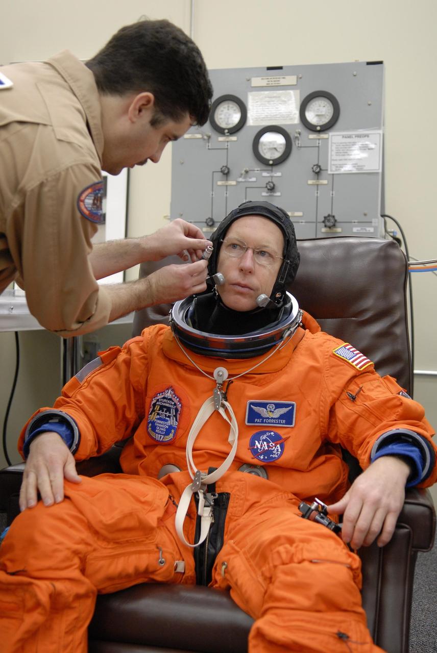 KENNEDY SPACE CENTER, FLA. -- Mission STS-117 Mission Specialist Patrick Forrester has donned his launch suit for a fit check, part of the pre-launch preparations during terminal countdown demonstration test (TCDT) activities. The mission crew is at KSC for the TCDT, which includes a simulated launch countdown. The STS-117 mission is No. 21 to the International Space Station. Mission payloads aboard Atlantis include the S3/S4 integrated truss structure, a third set of solar arrays and batteries. The crew of six astronauts will install the truss to continue assembly of the station. Launch is scheduled for no earlier than March 15. Photo credit: NASA/Kim Shiflett.